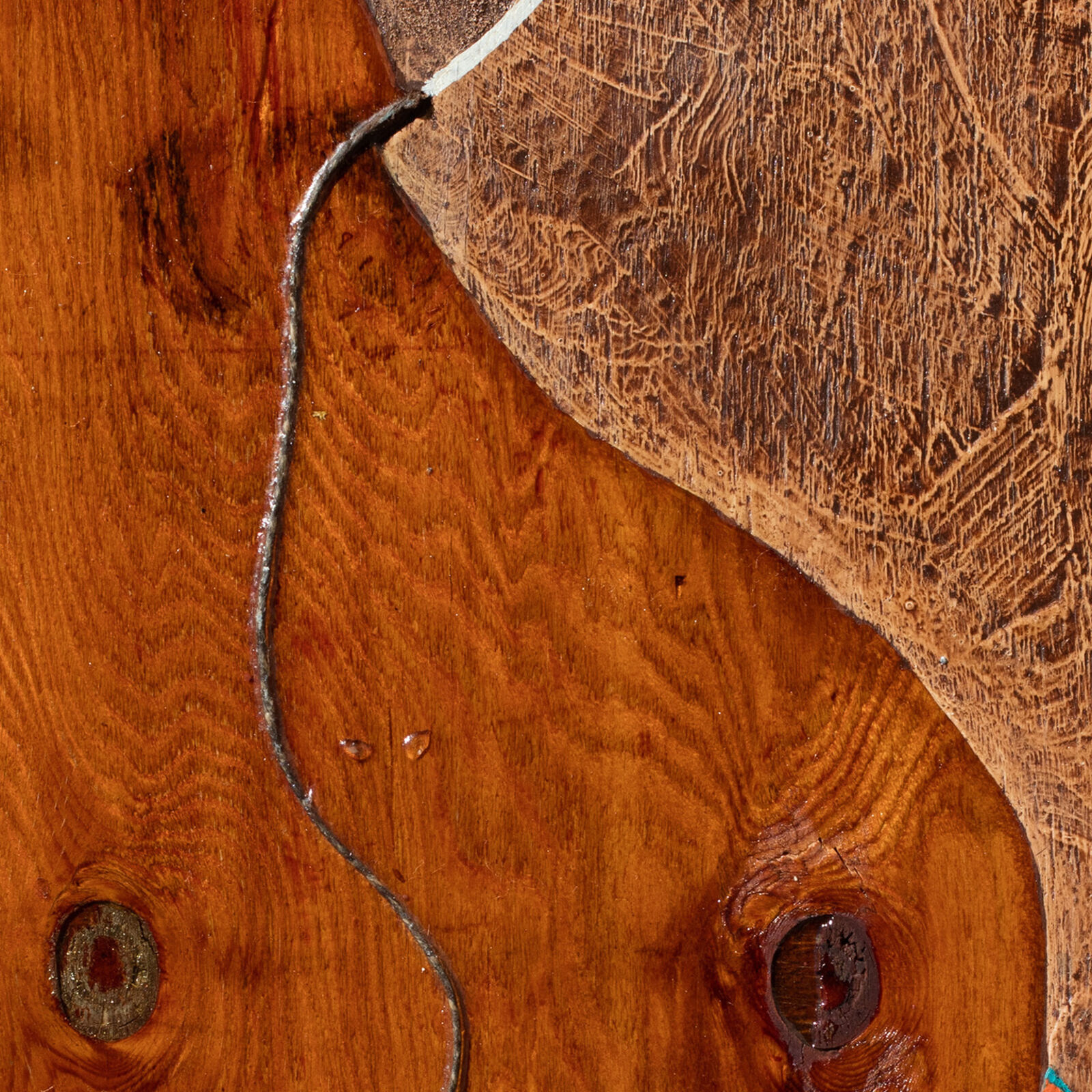 A collage of a horse head on a piece of wood.