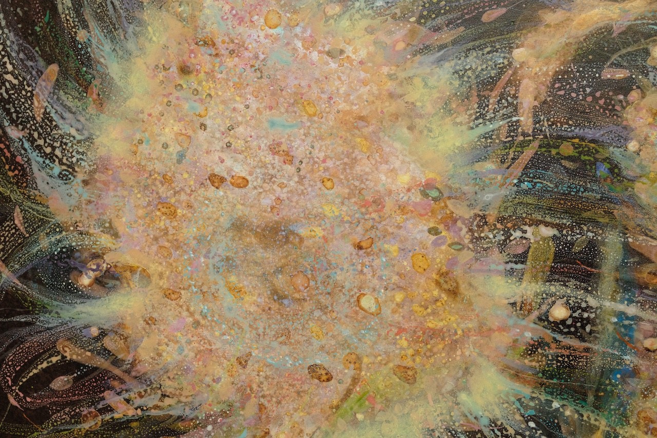 An abstract, textured composition featuring a central dark form surrounded by splattered gold and earthy tones.