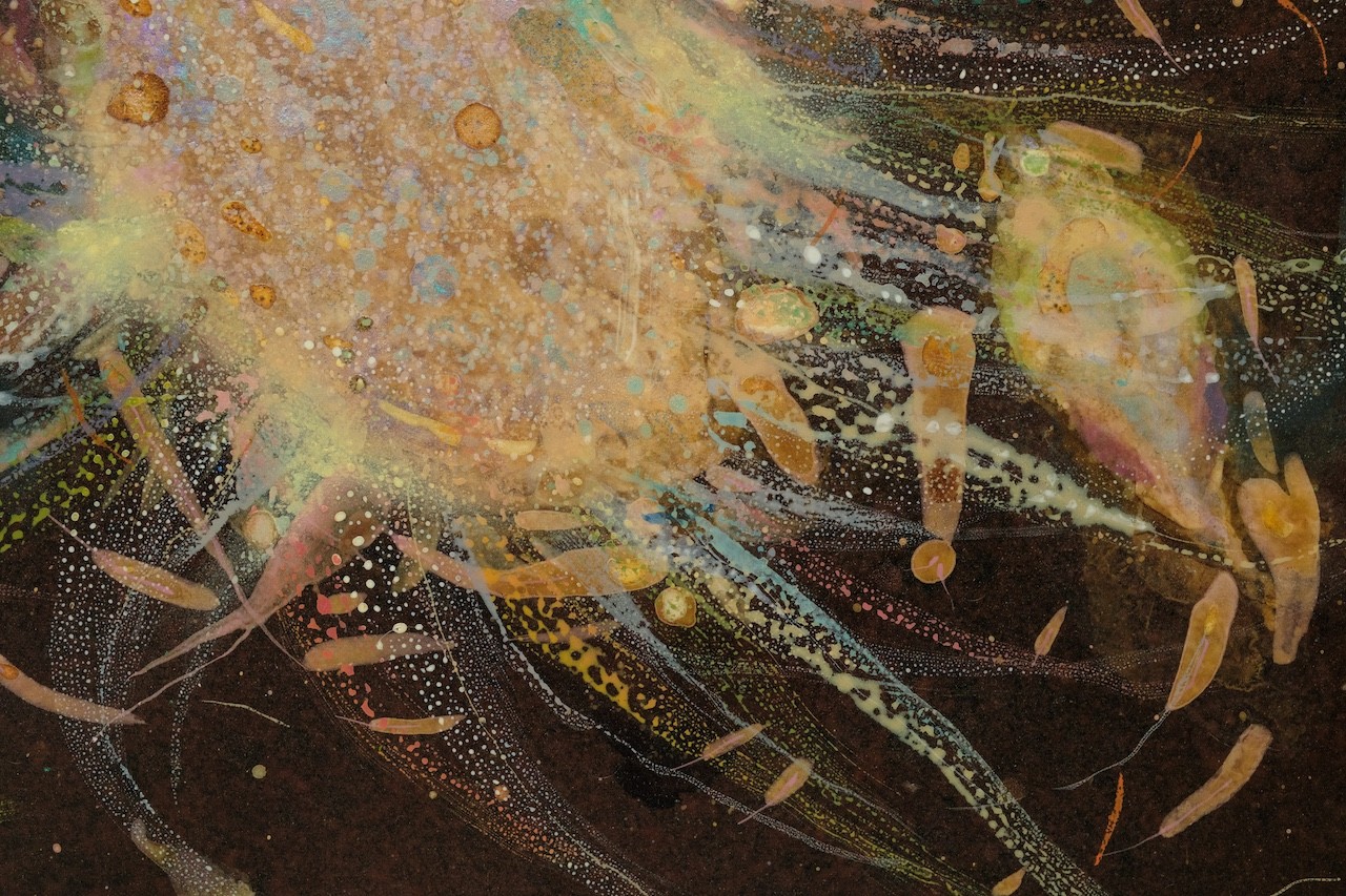 An abstract, textured composition featuring a central dark form surrounded by splattered gold and earthy tones.
