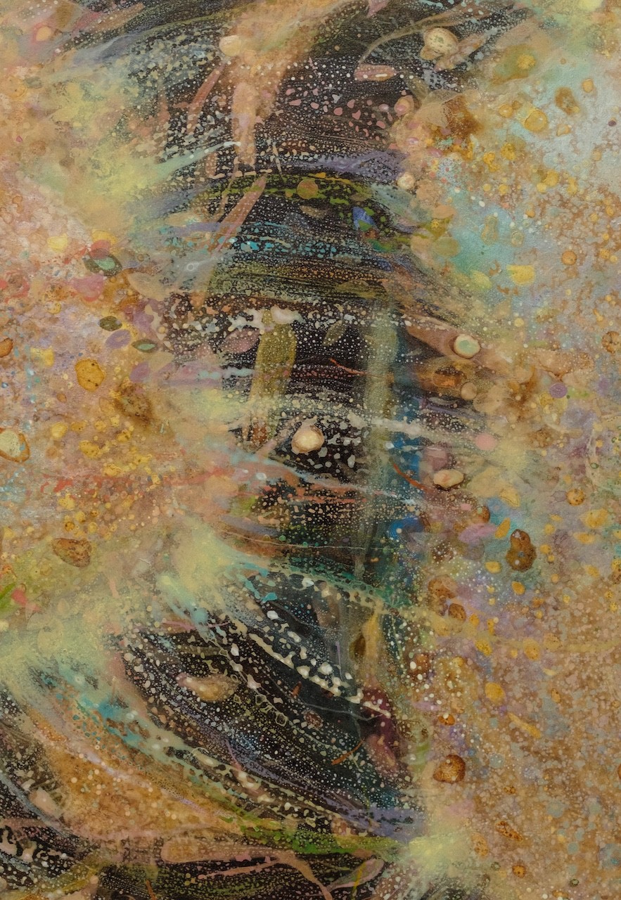 An abstract, textured composition featuring a central dark form surrounded by splattered gold and earthy tones.
