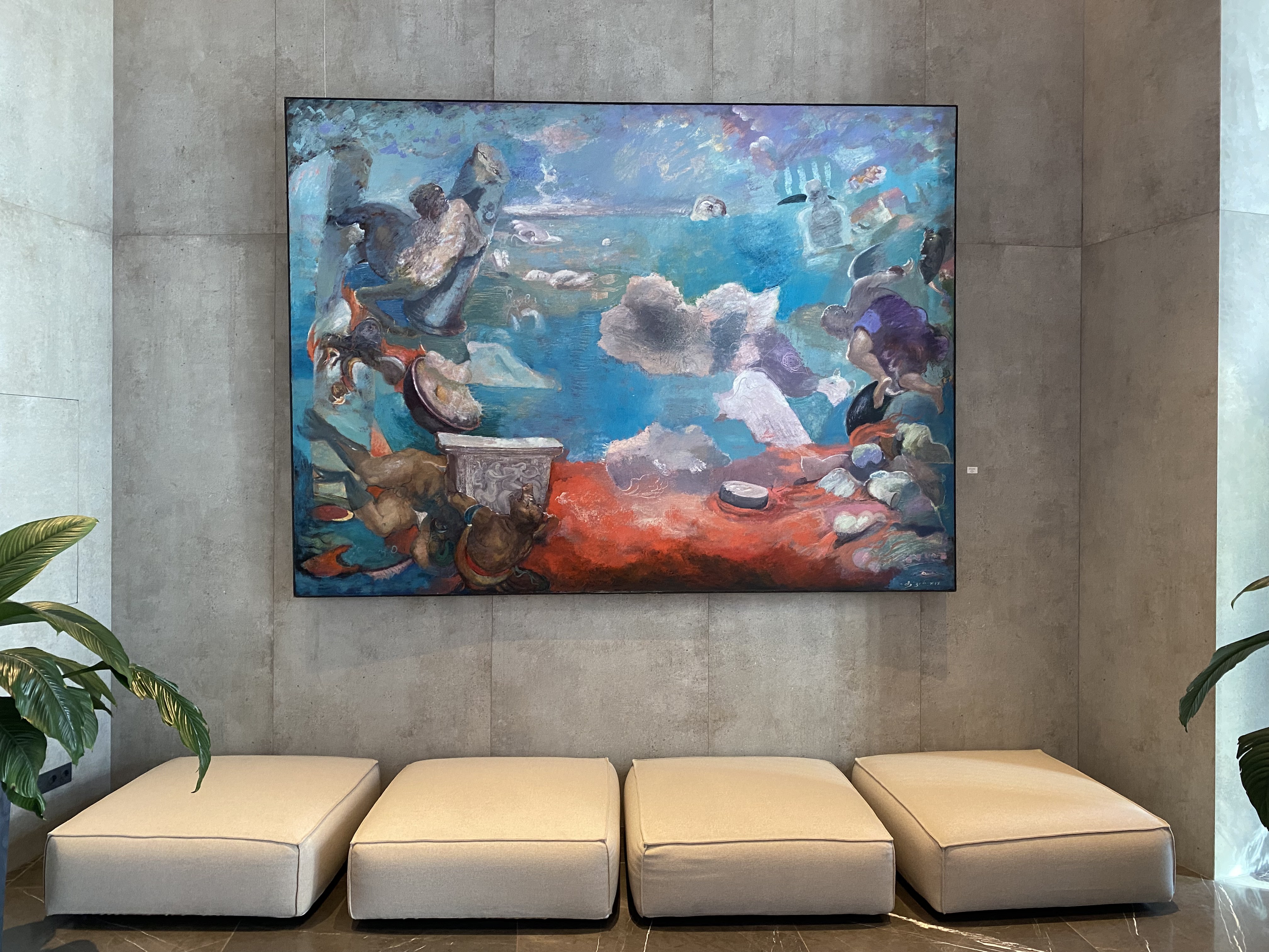 A large painting hanging on the wall in a room.