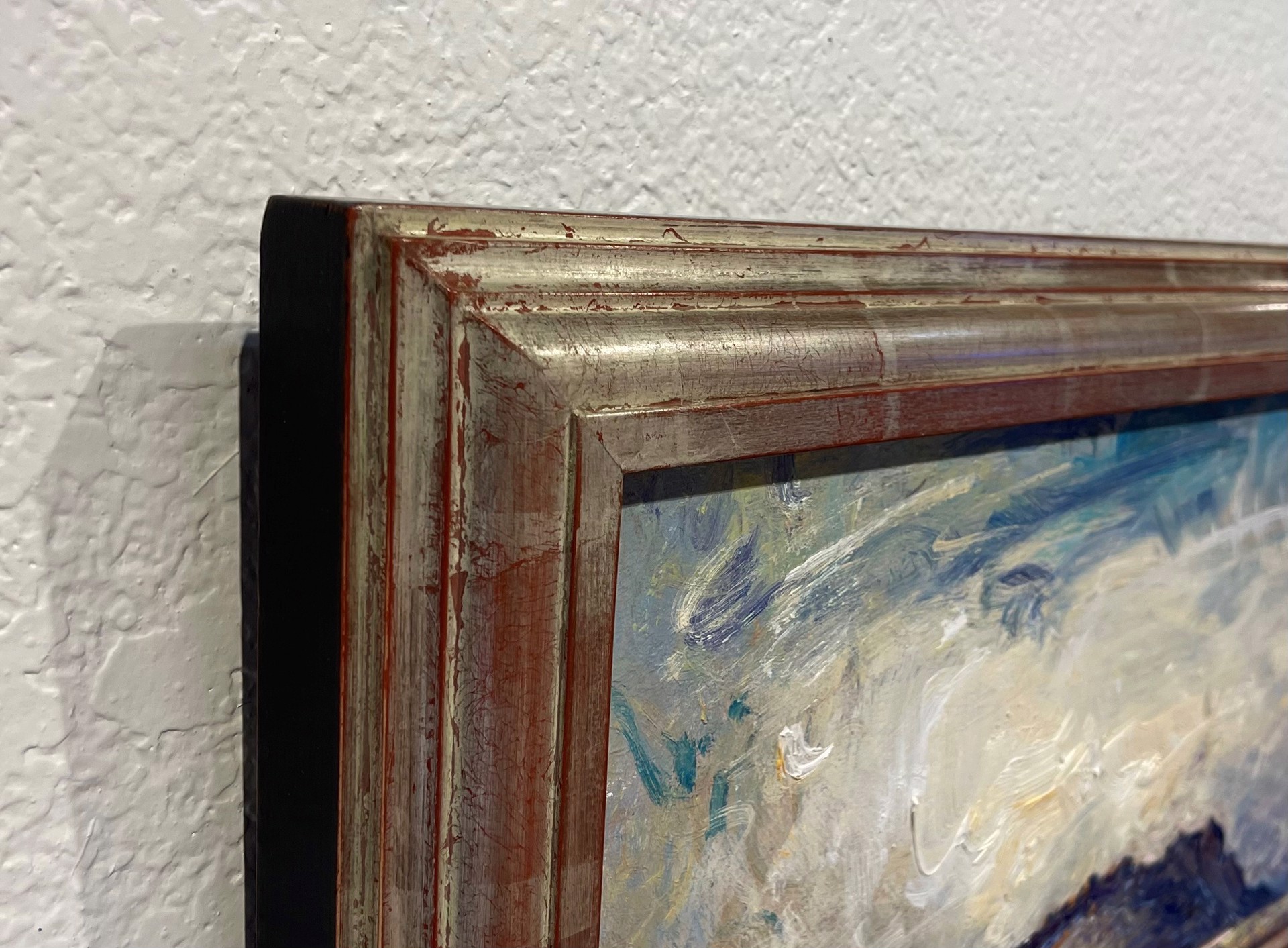 A painting of a cloudy sky over a mountain.