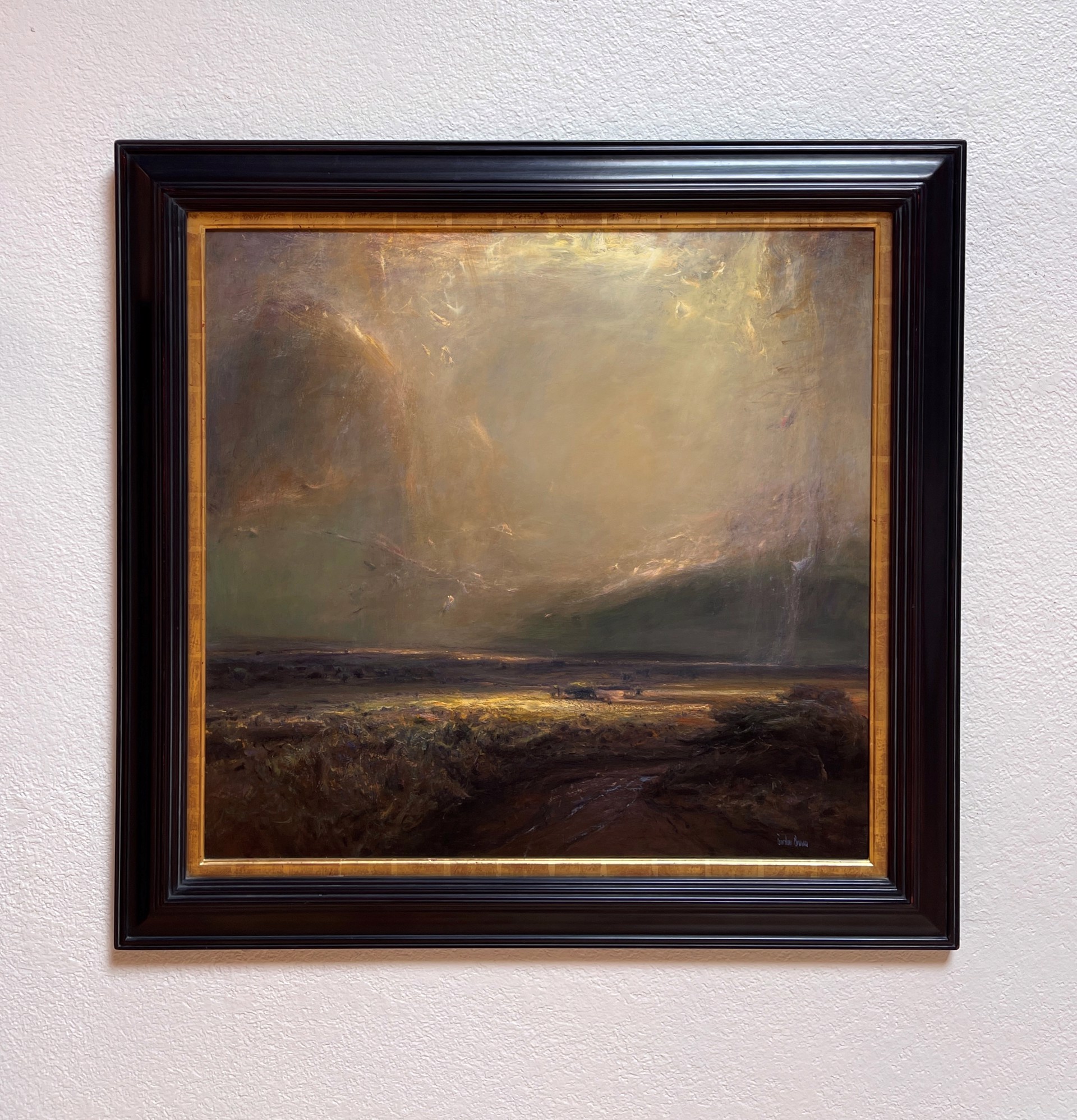 A dramatic landscape painting featuring a vast, hazy sky and a dark, textured foreground.