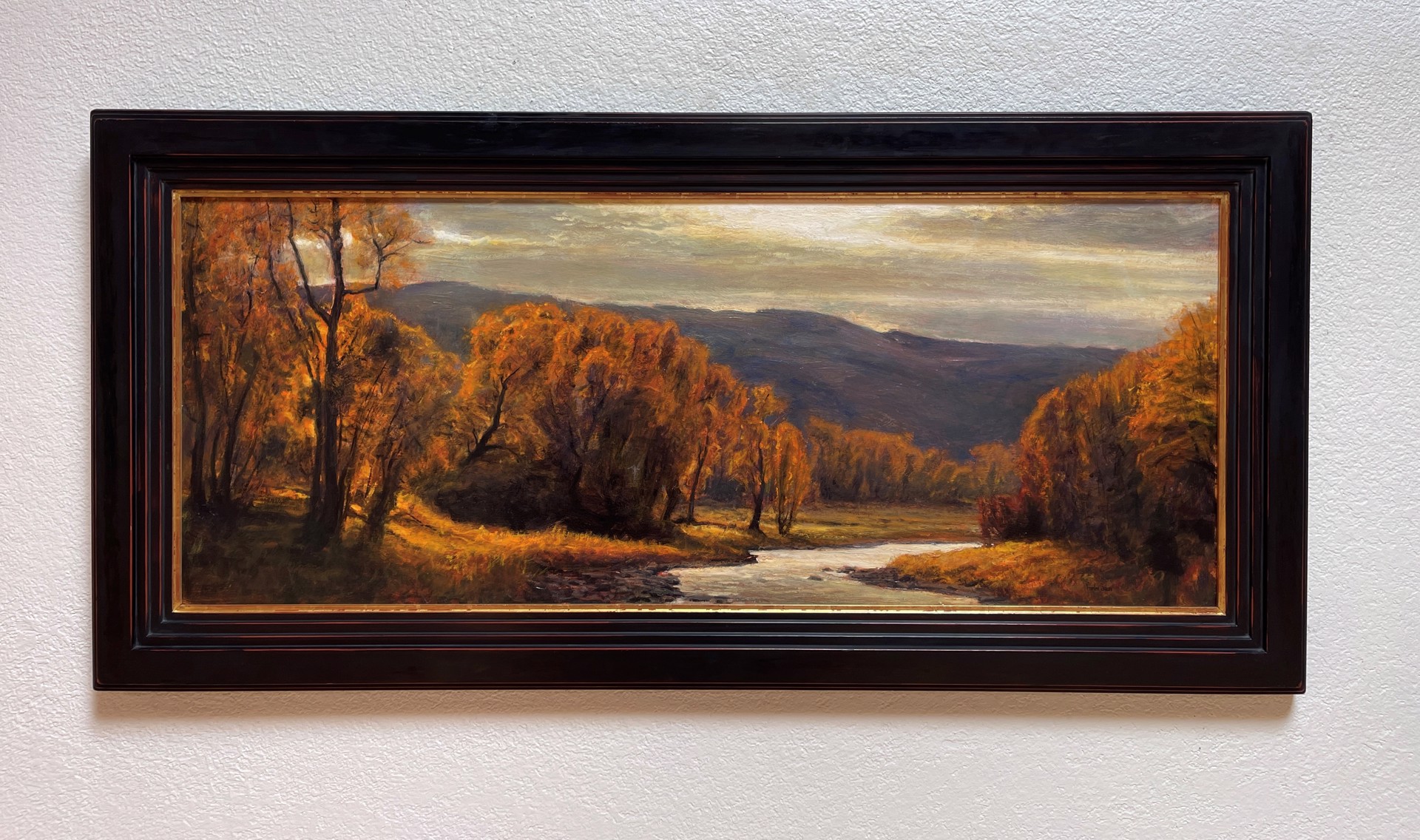 A painting of a river in the middle of a forest.