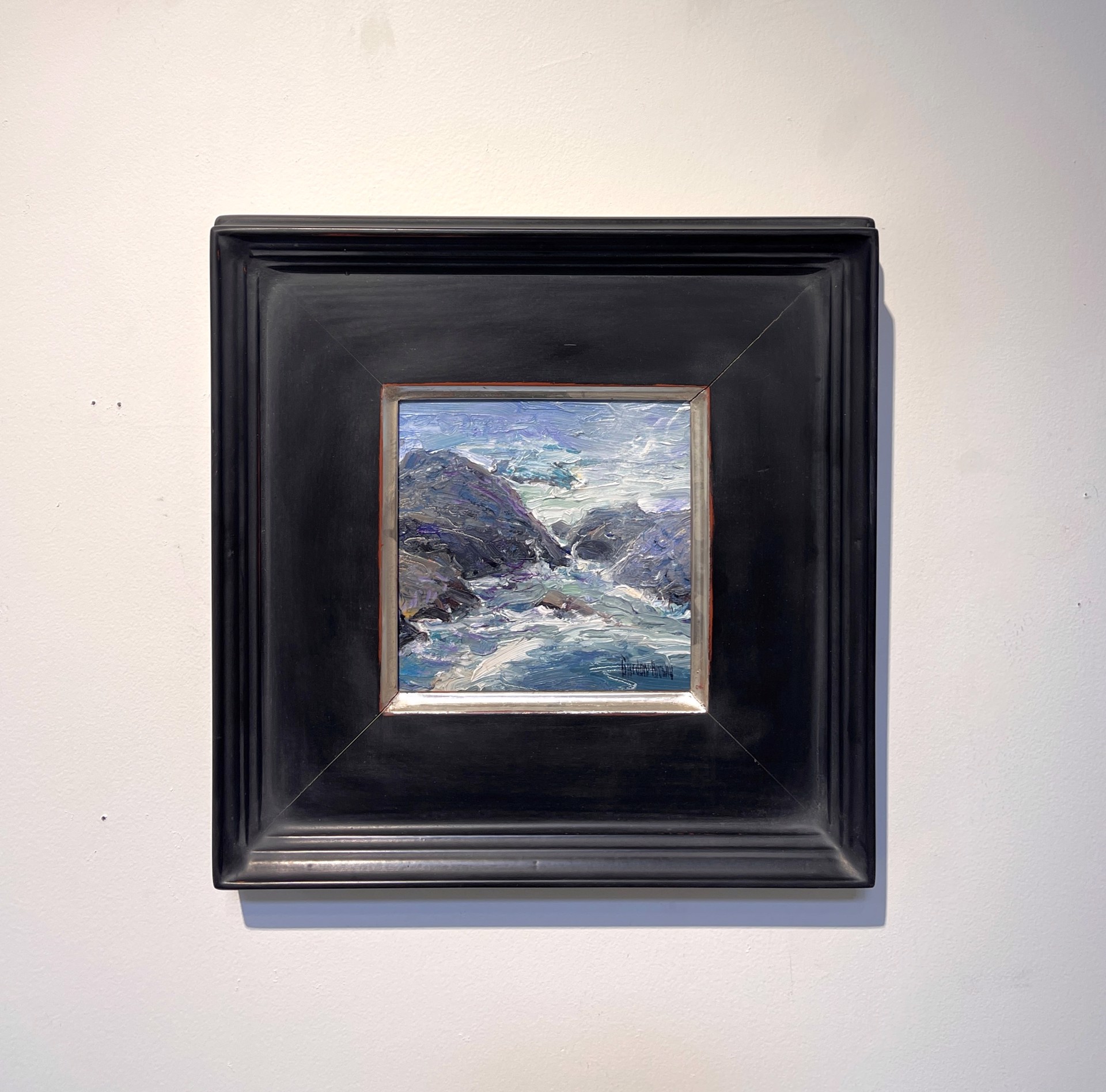 A thickly painted seascape of dark rocks and churning water.