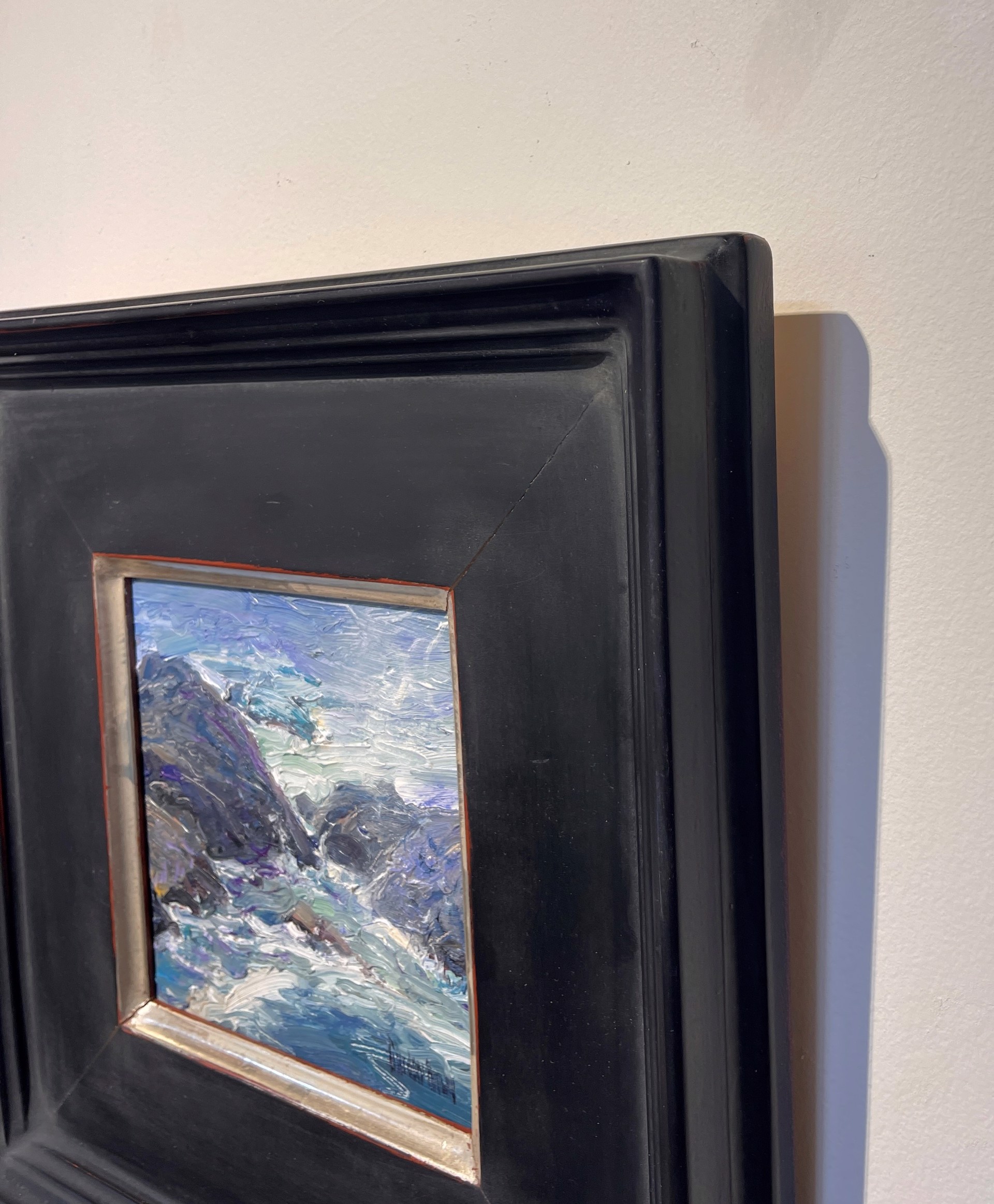 A thickly painted seascape of dark rocks and churning water.