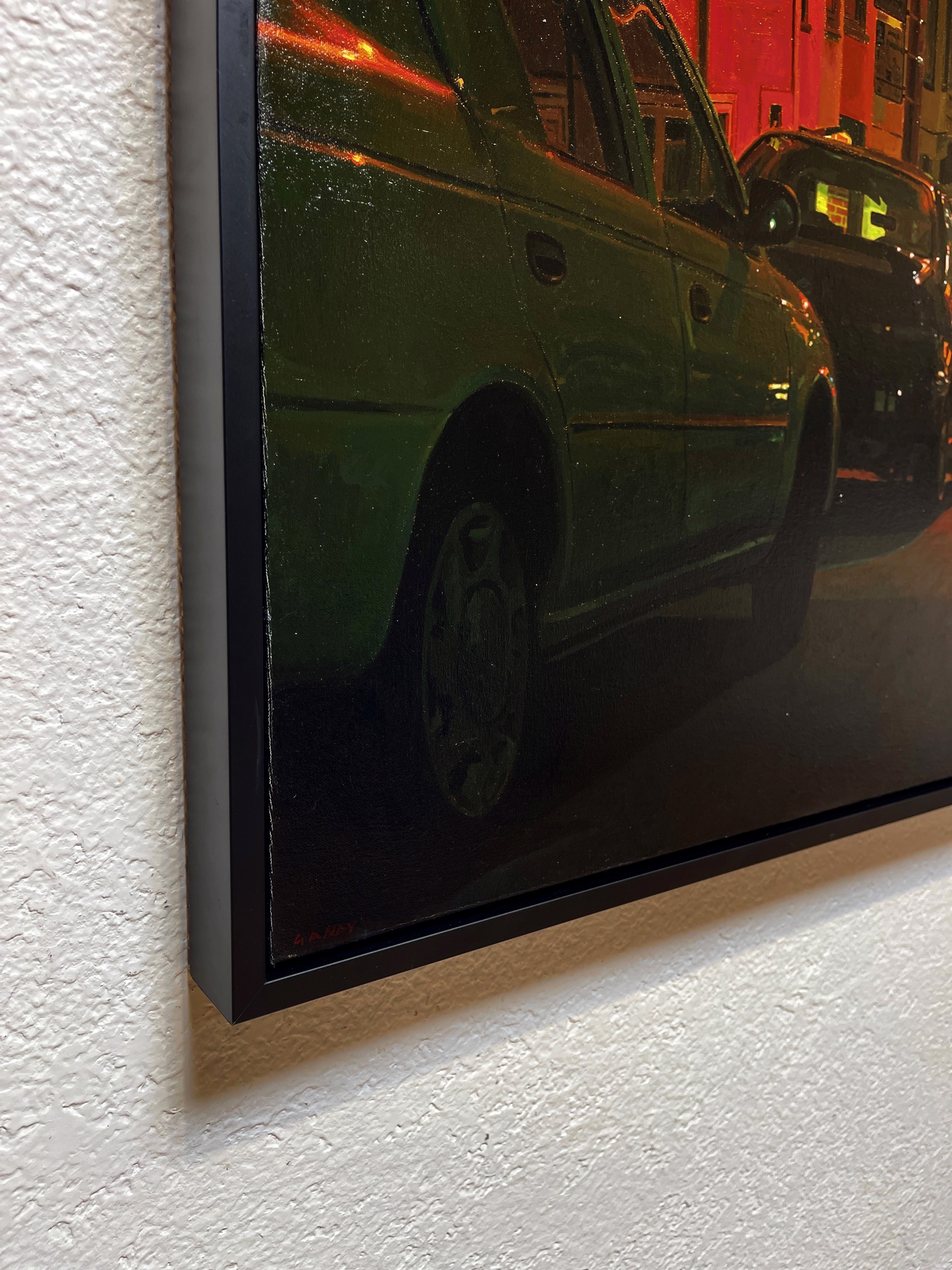 A painting of a city street at night with cars parked on the side of the road.