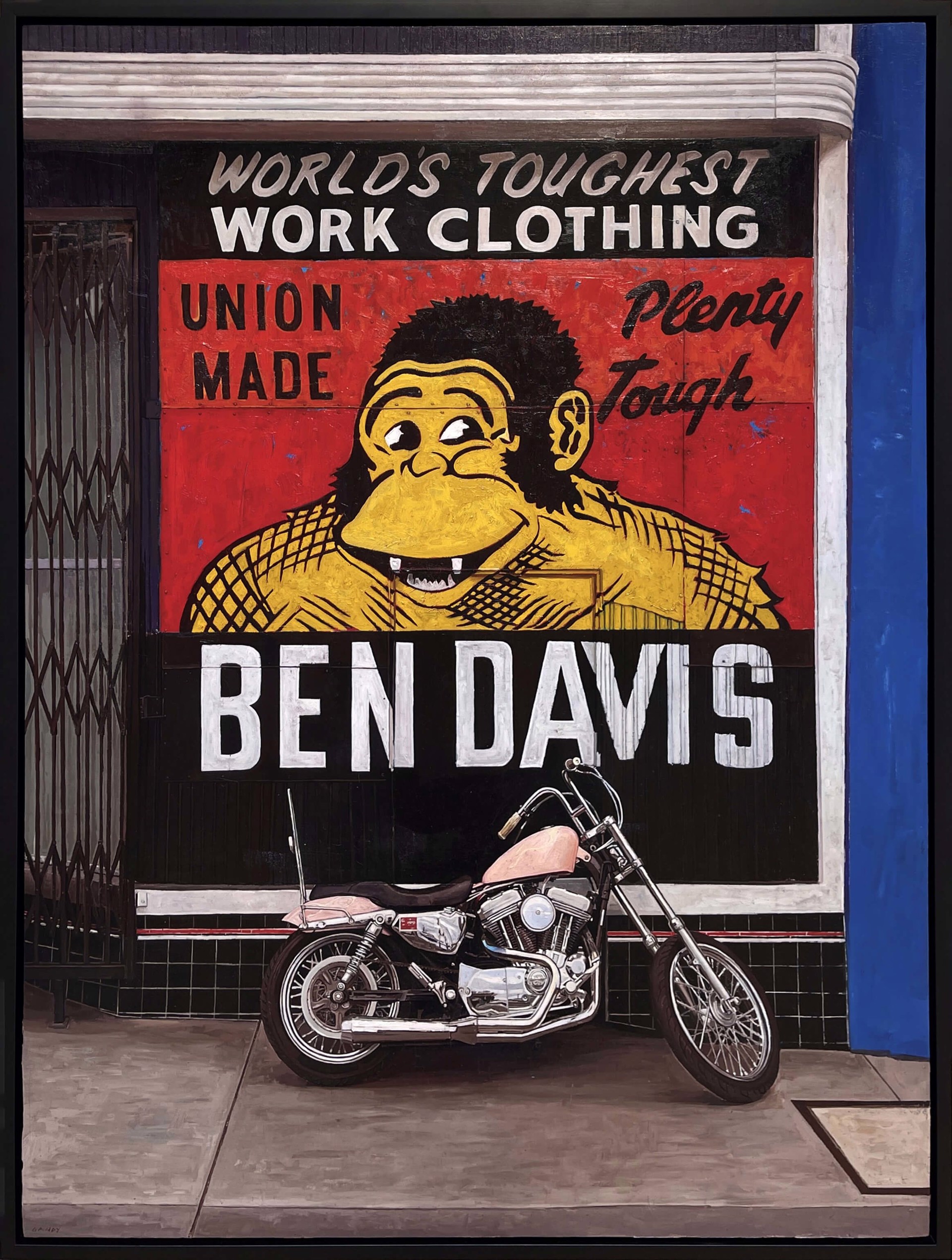 A motorcycle parked in front of a building with a sign on it.