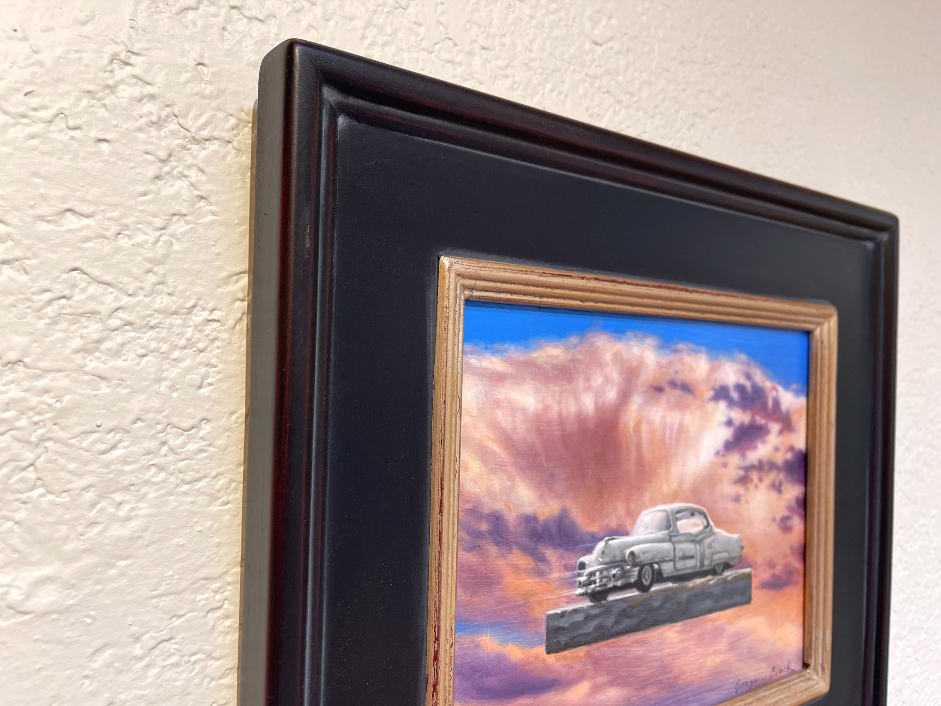 A painting of an old car sitting on top of a wooden block.