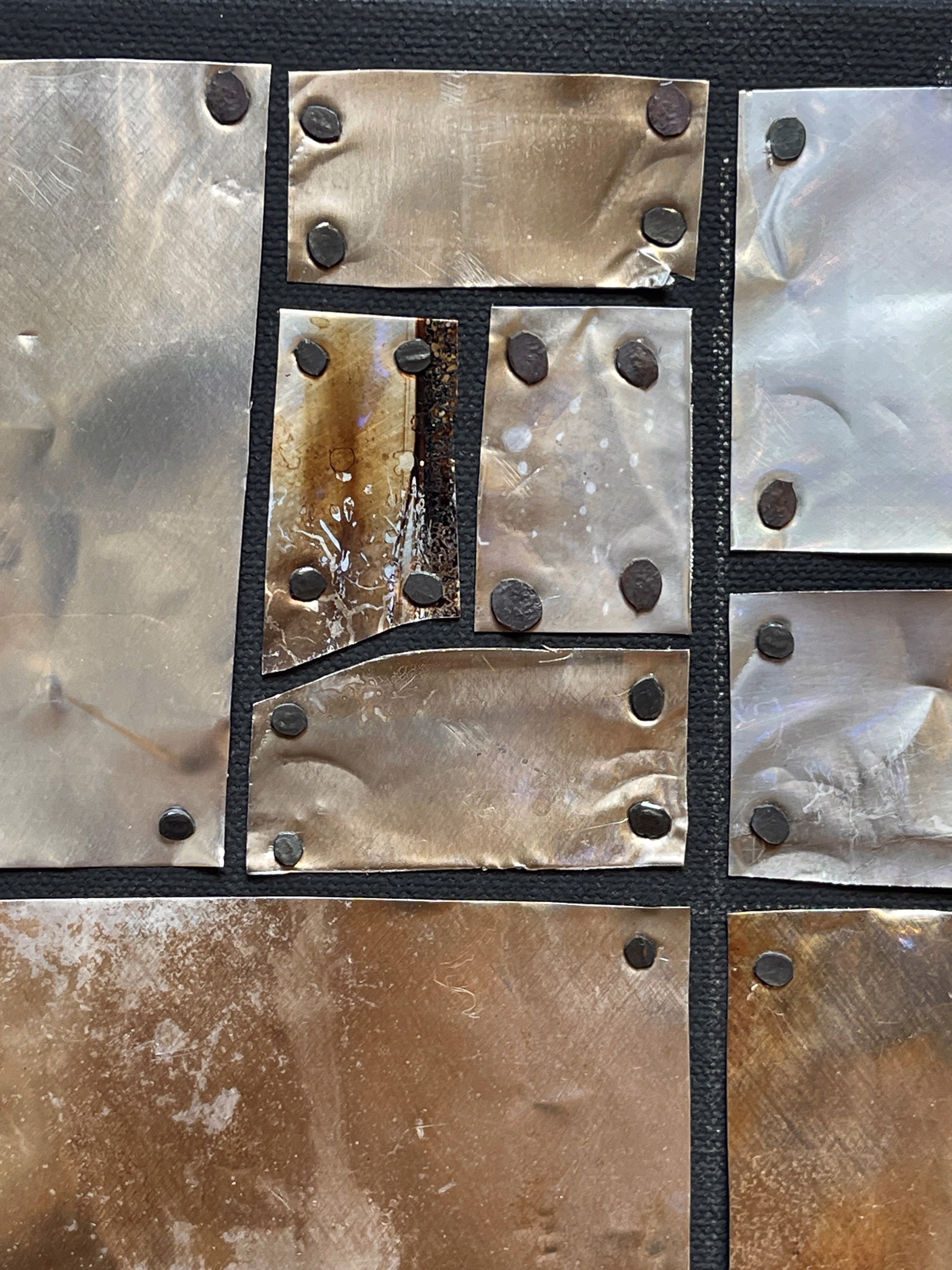 a close up of a metal wall with a pattern on it