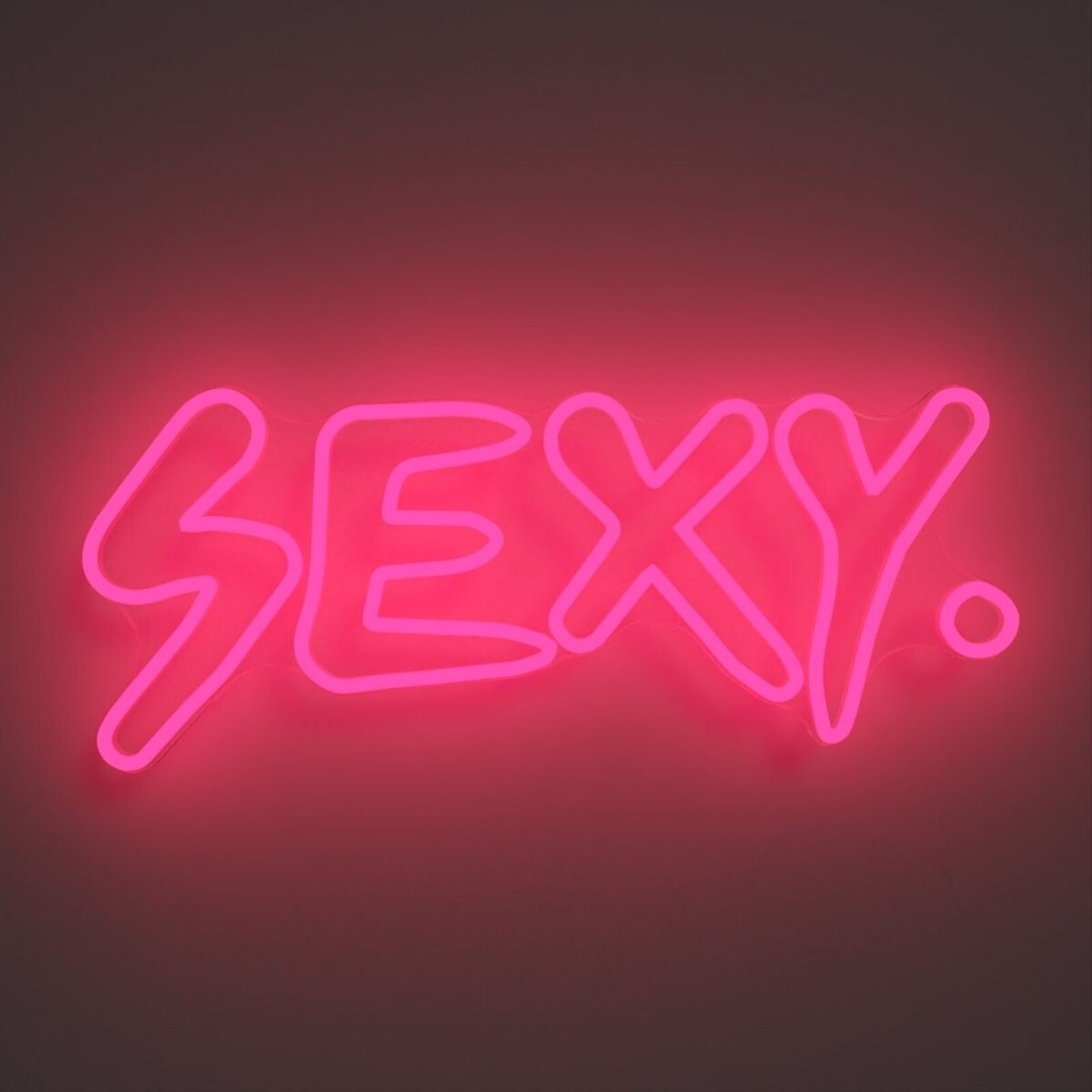 A neon sign that says "SEXY" on a wall.
