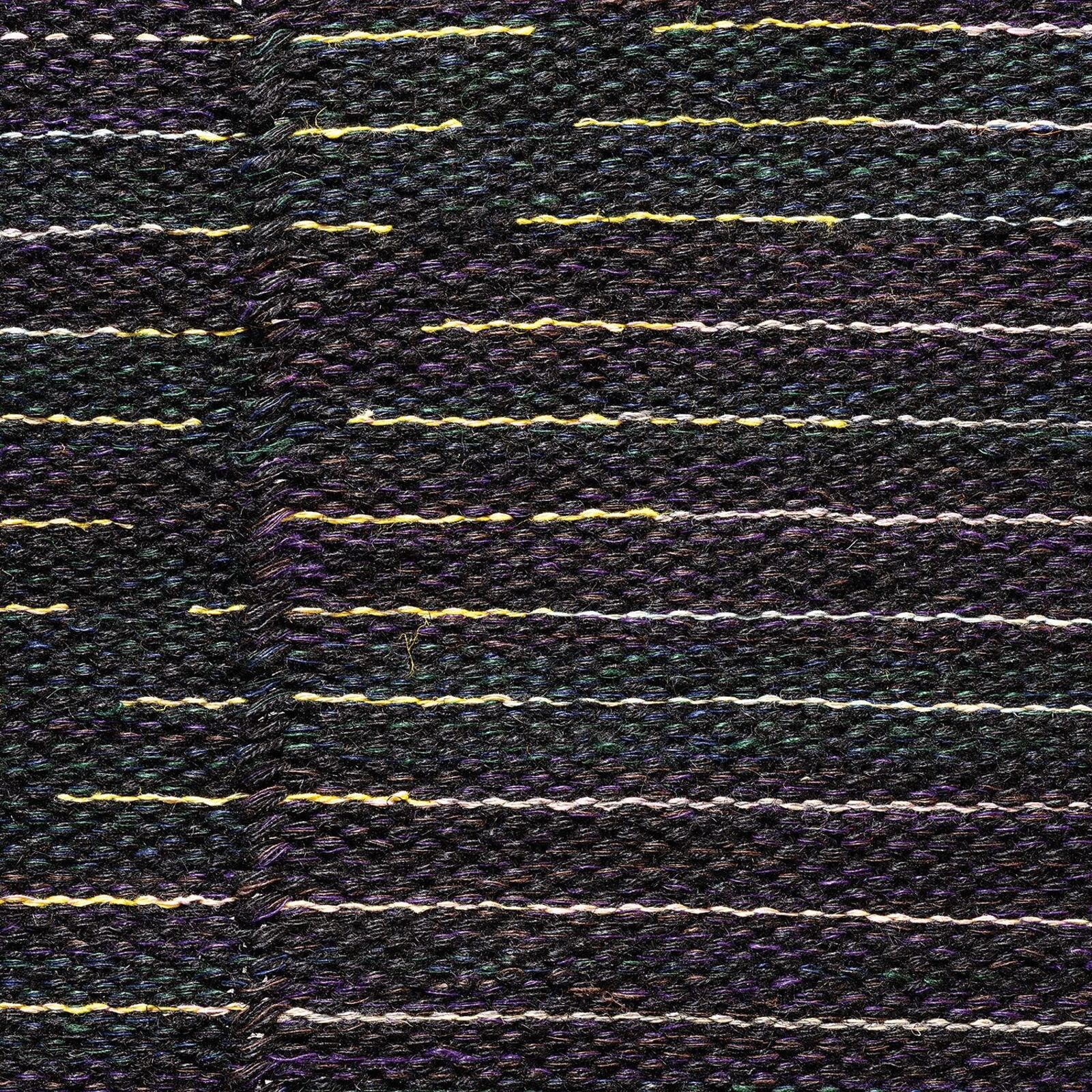 A woven textile artwork featuring a dark background with horizontal lines of white and yellow threads.