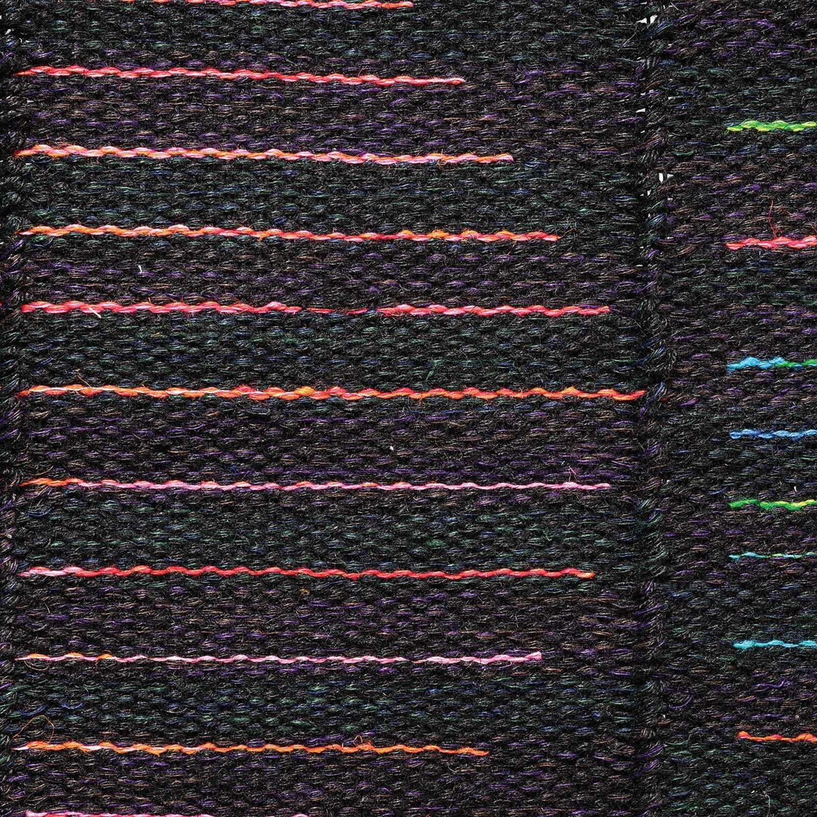A woven textile featuring a central geometric pattern of horizontal lines against a dark background.