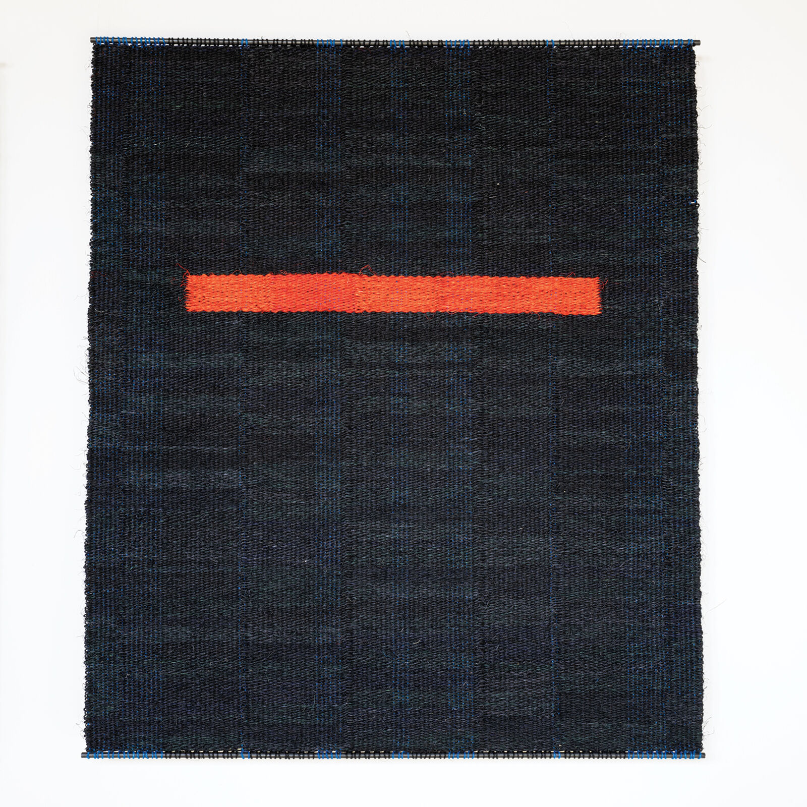 A piece of fabric with a red line on it.