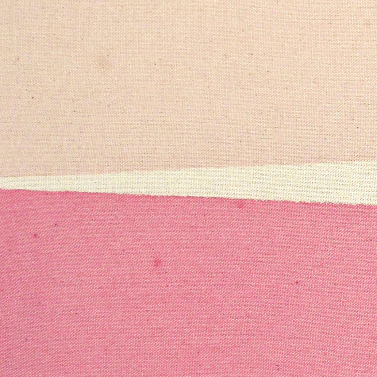 A piece of paper with a pink and beige stripe on it.