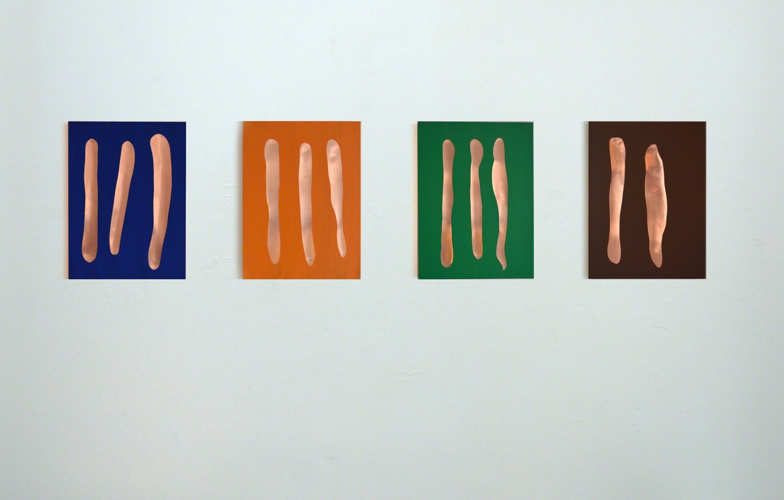 A minimalist composition of three peach-colored vertical shapes against a deep blue background.