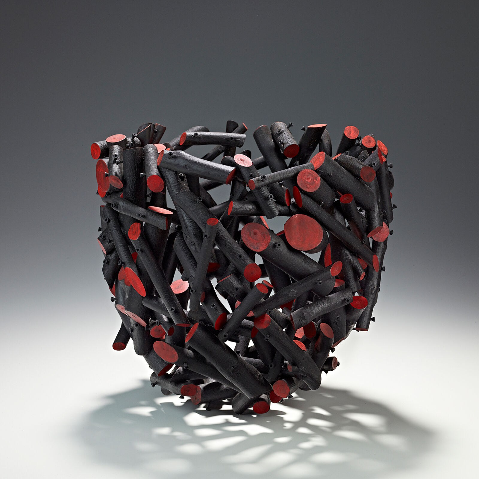 A sculpture of a heart made out of sticks. 