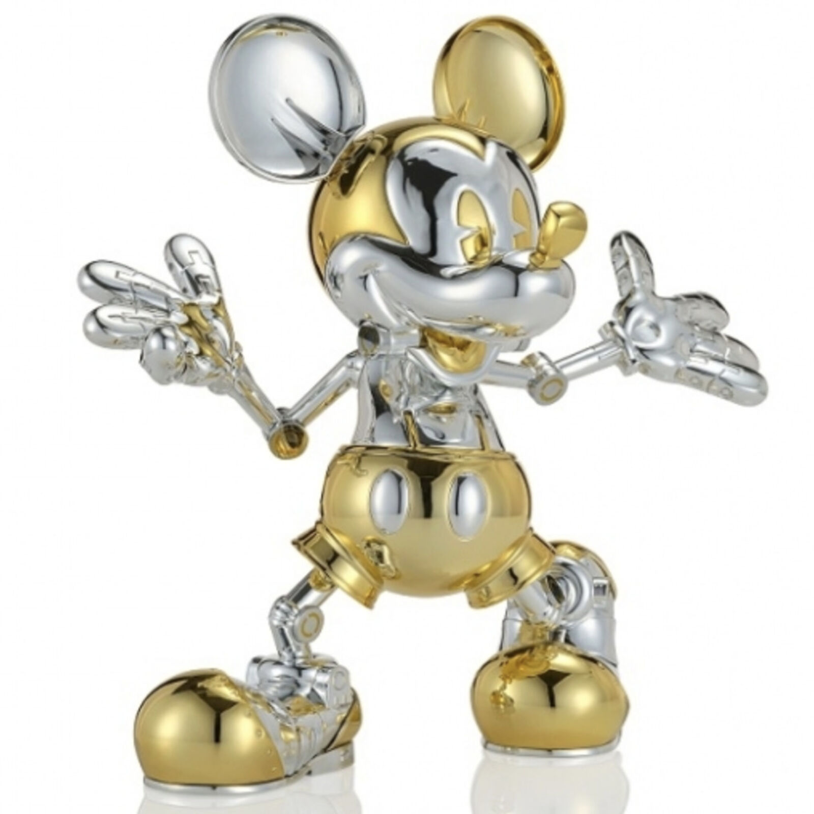 A silver and gold mickey mouse figurine on a white background.