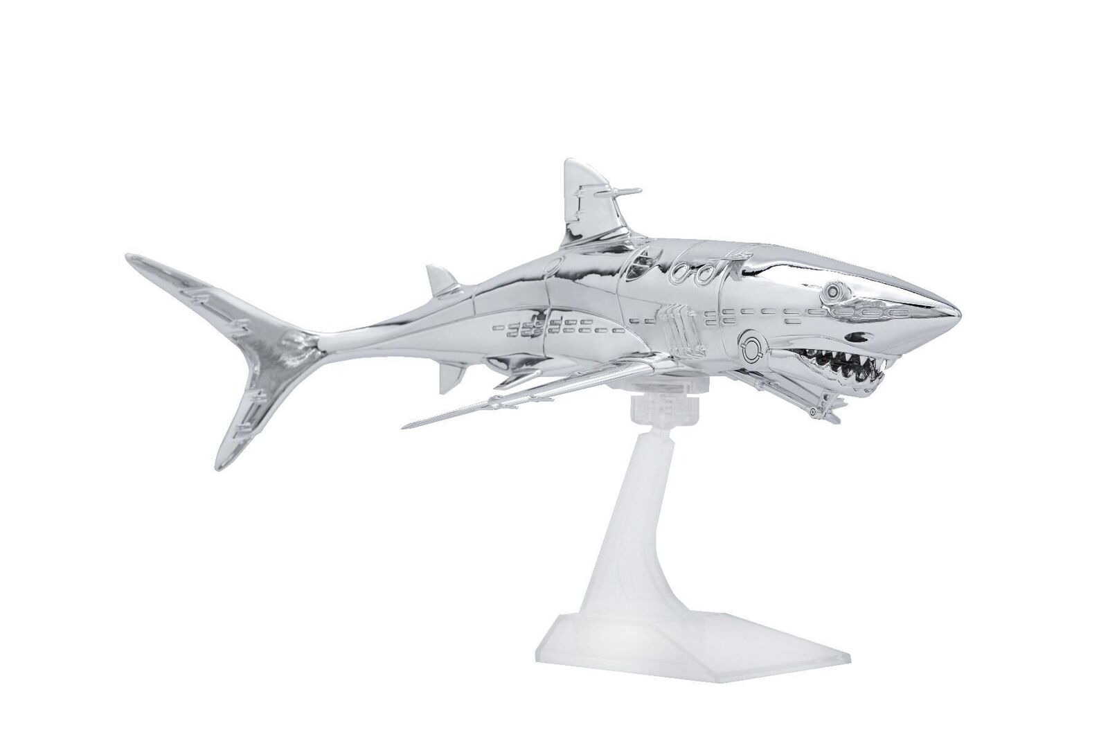 A silver model of a shark on a white background.