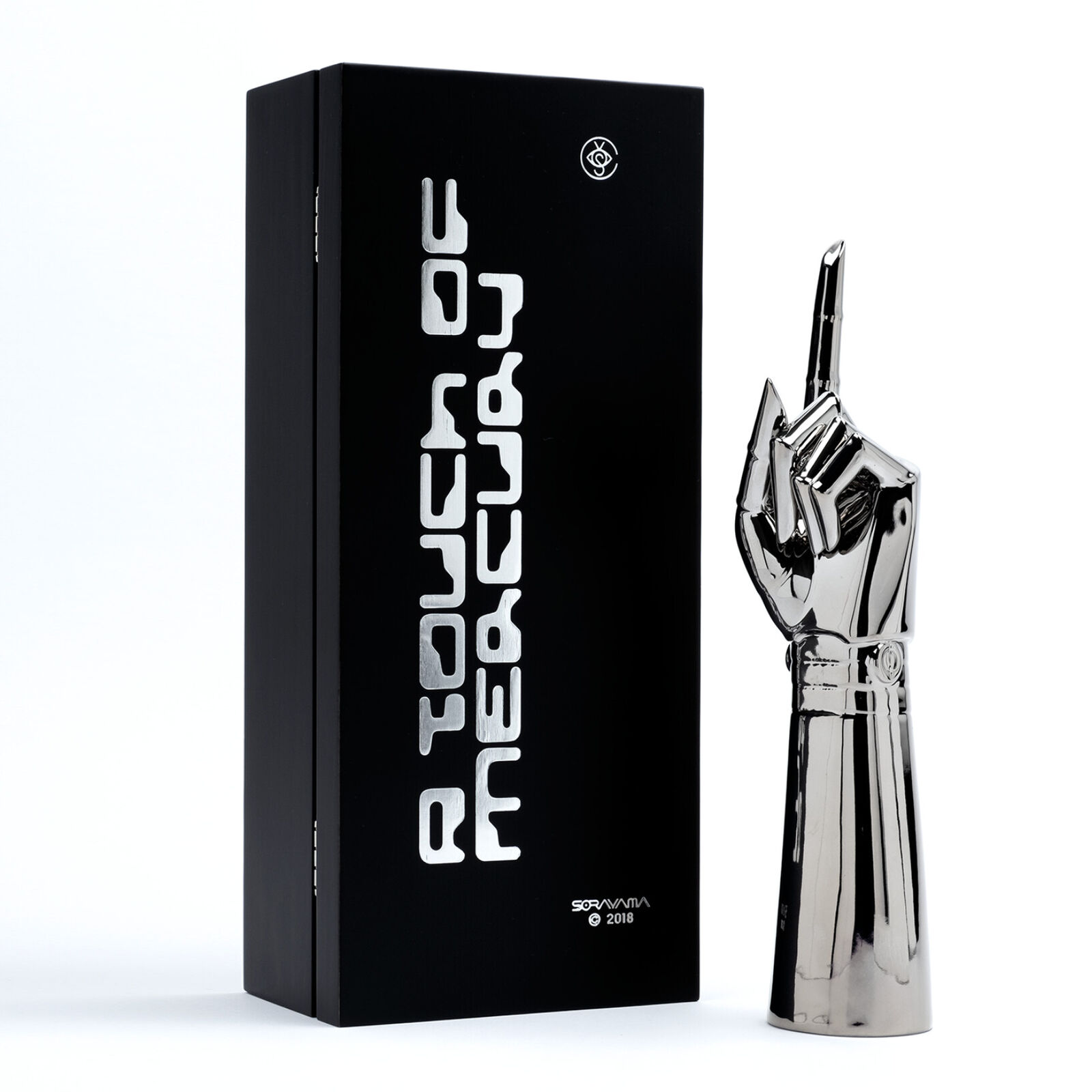 A silver pen holder with a pen in it.