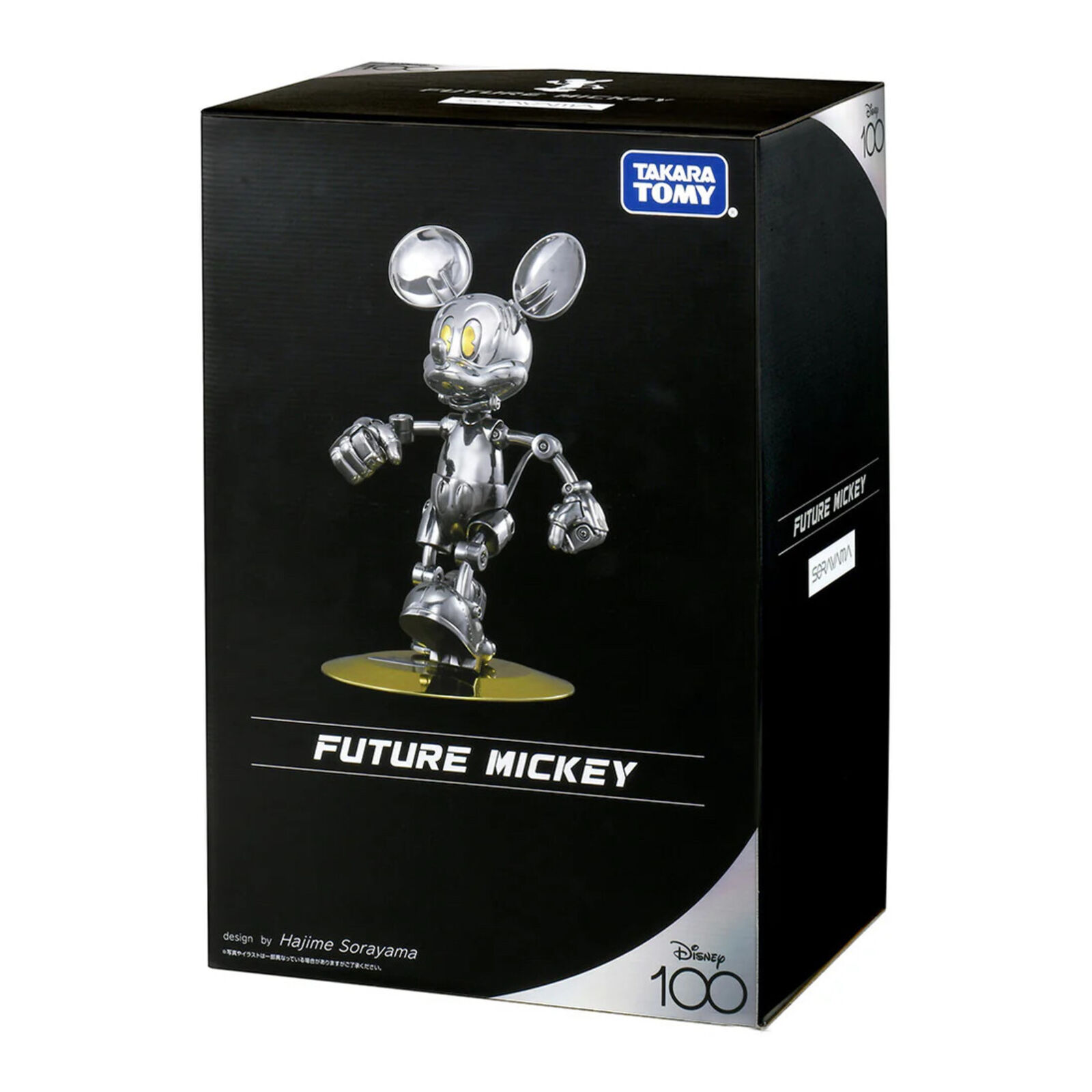 A silver and gold figurine of a mickey mouse.