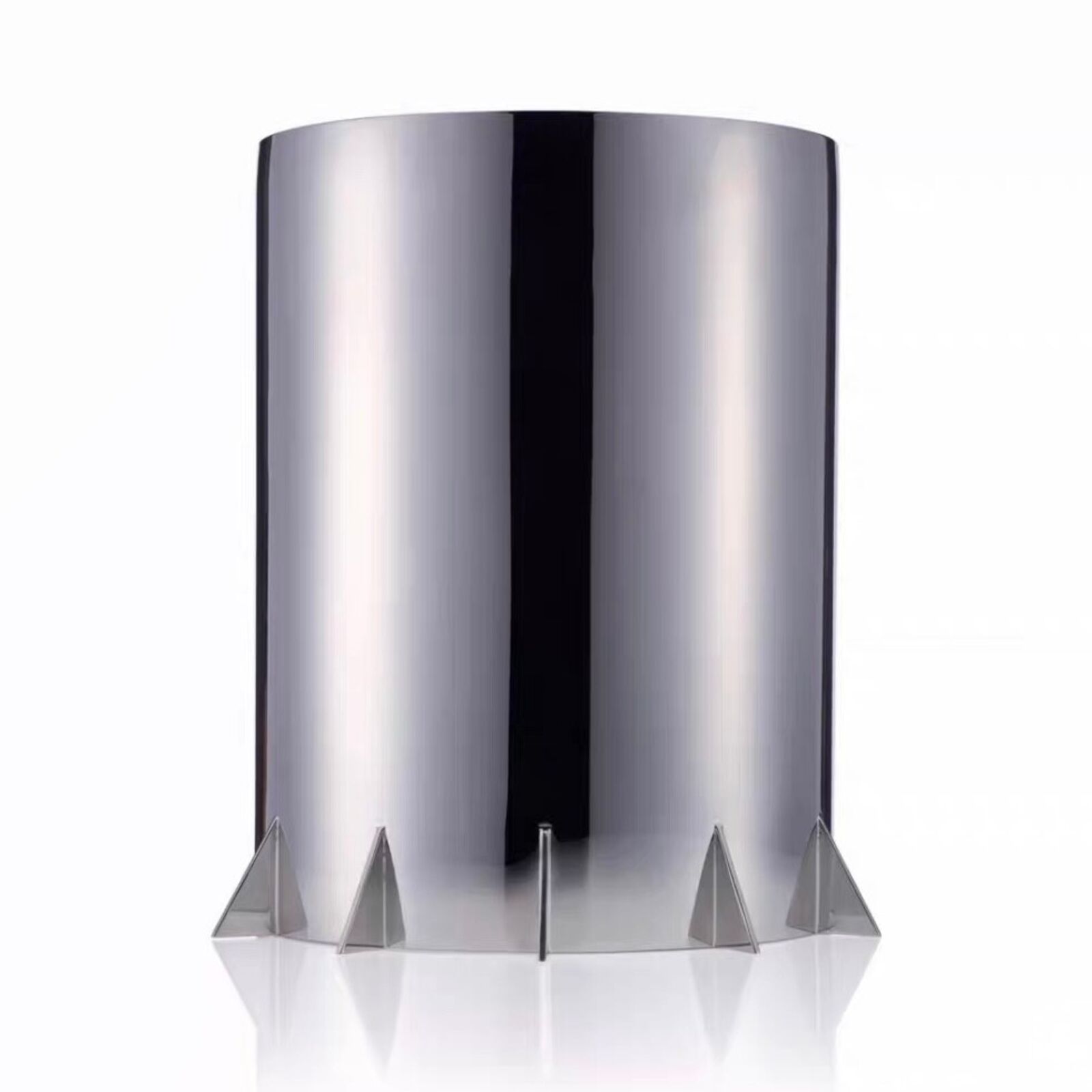 A silver sculpture of a man sitting on top of a toilet.