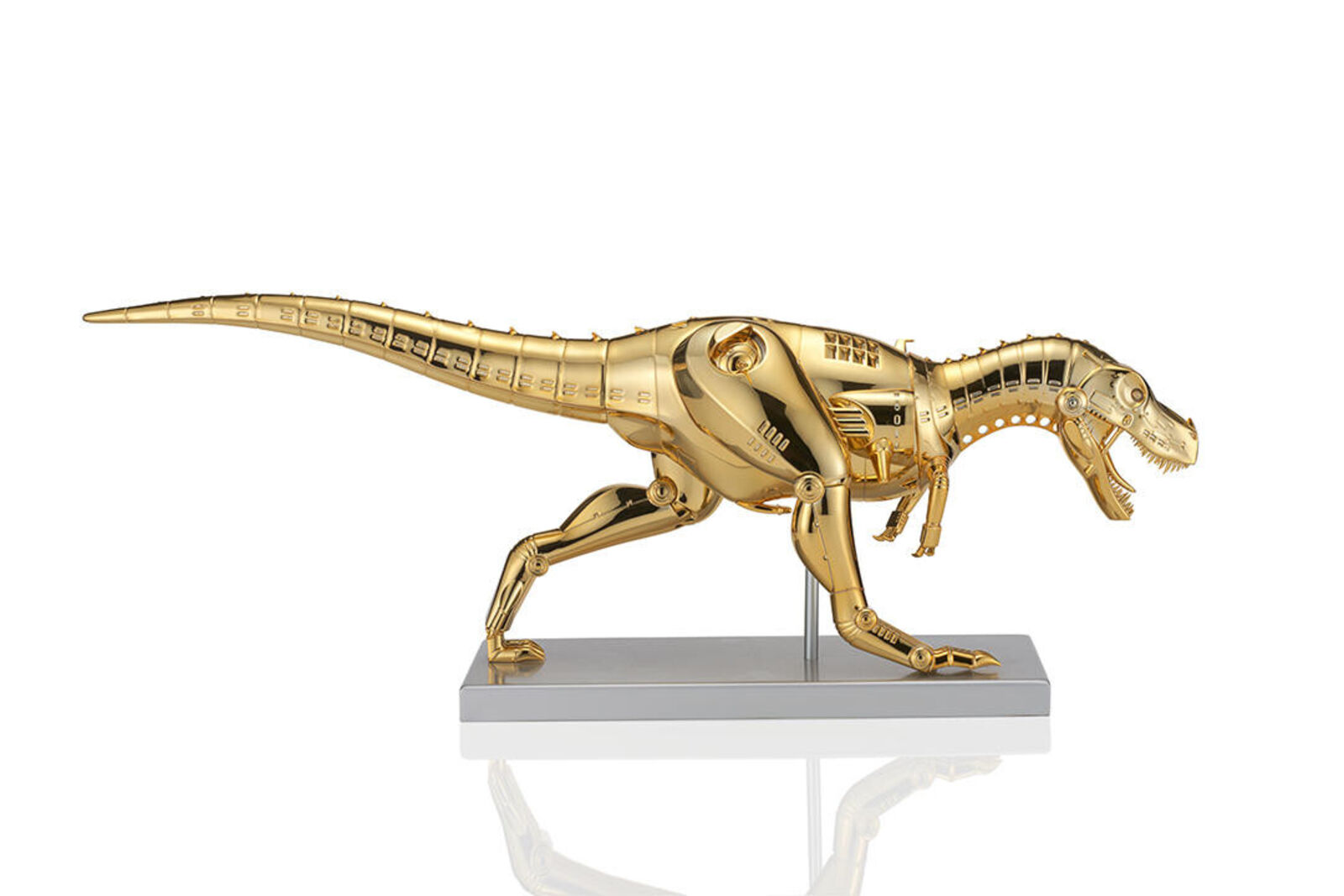 A gold model of a t-rex on a white background.