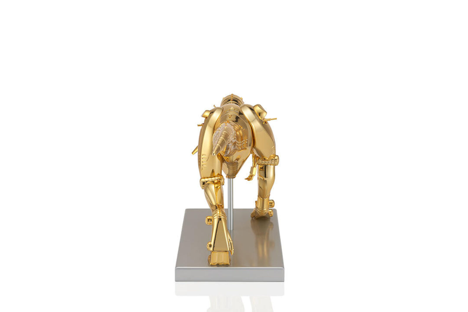 A gold model of a t-rex on a white background.