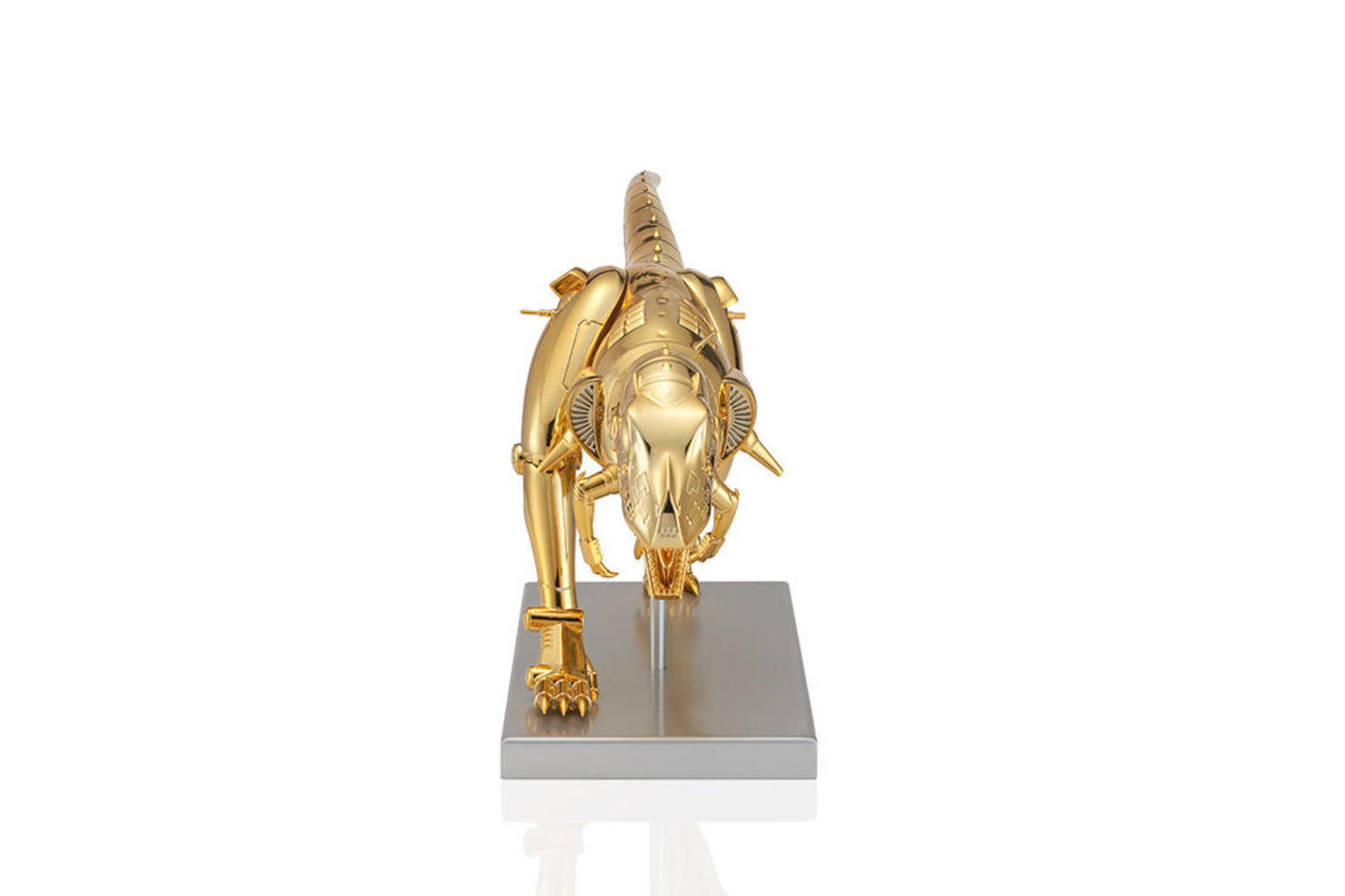 A gold model of a t-rex on a white background.