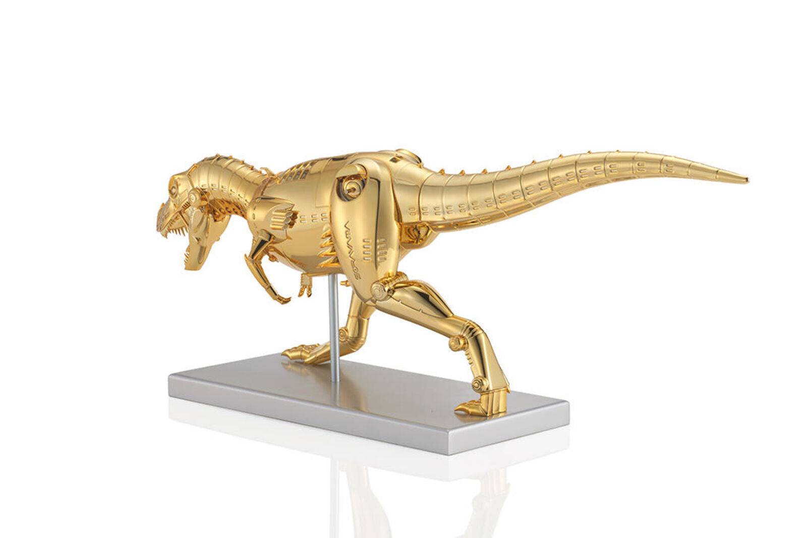A gold model of a t-rex on a white background.