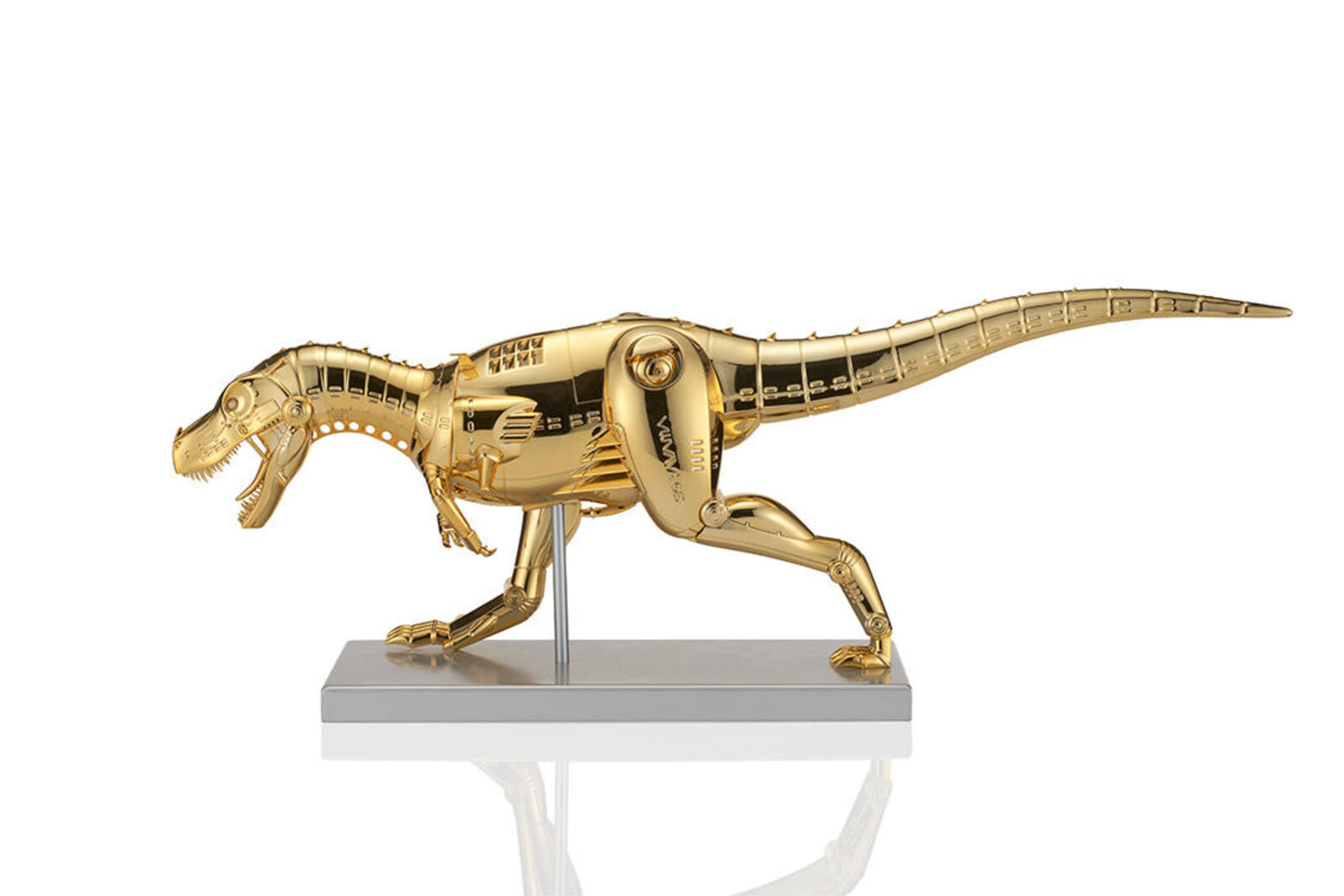 A gold model of a t-rex on a white background.