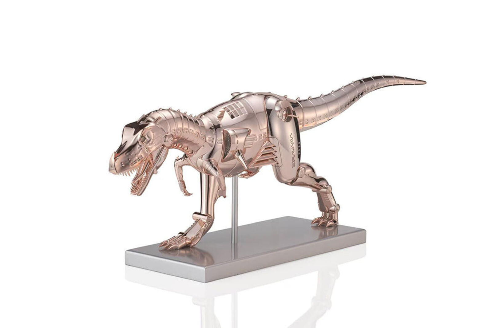 A metal model of a t-rex on a metal stand.