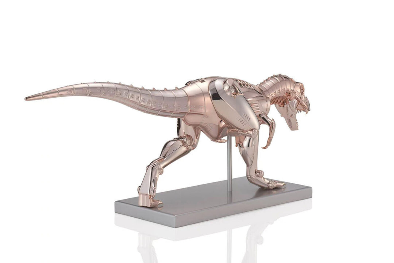 A metal model of a t-rex on a metal stand.