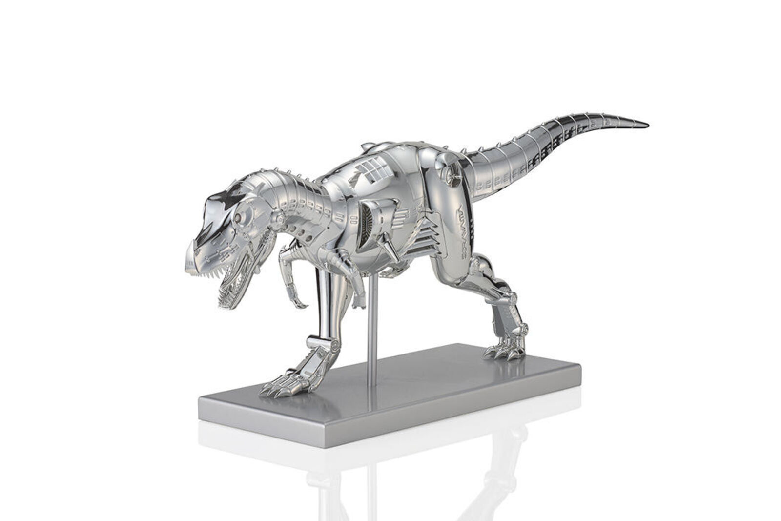 A metal model of a t-rex on a white background.