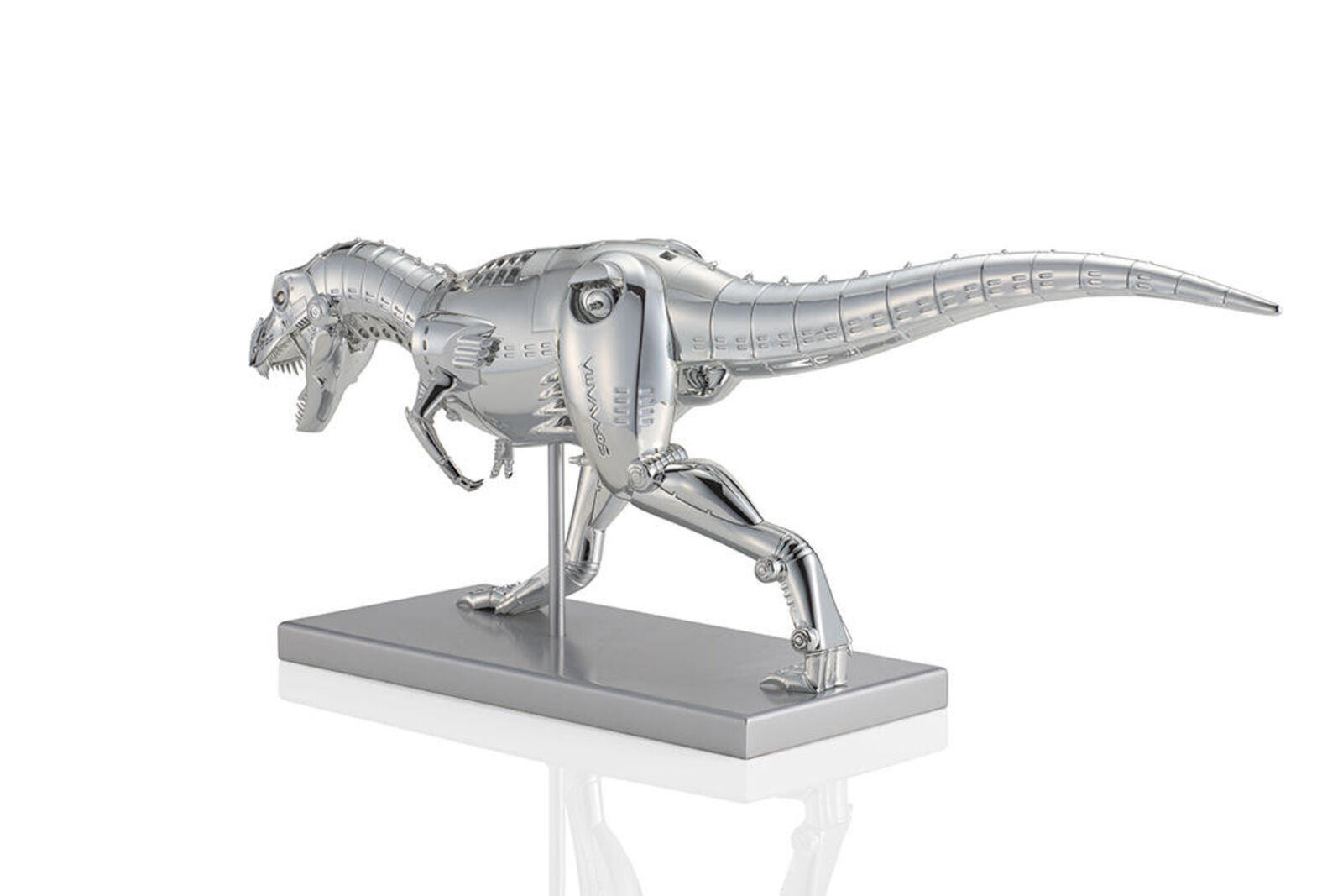 A metal model of a t-rex on a white background.