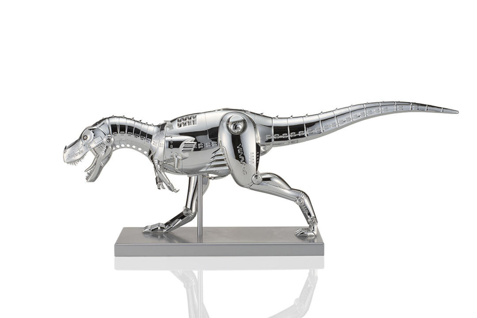 A metal model of a t-rex on a white background.
