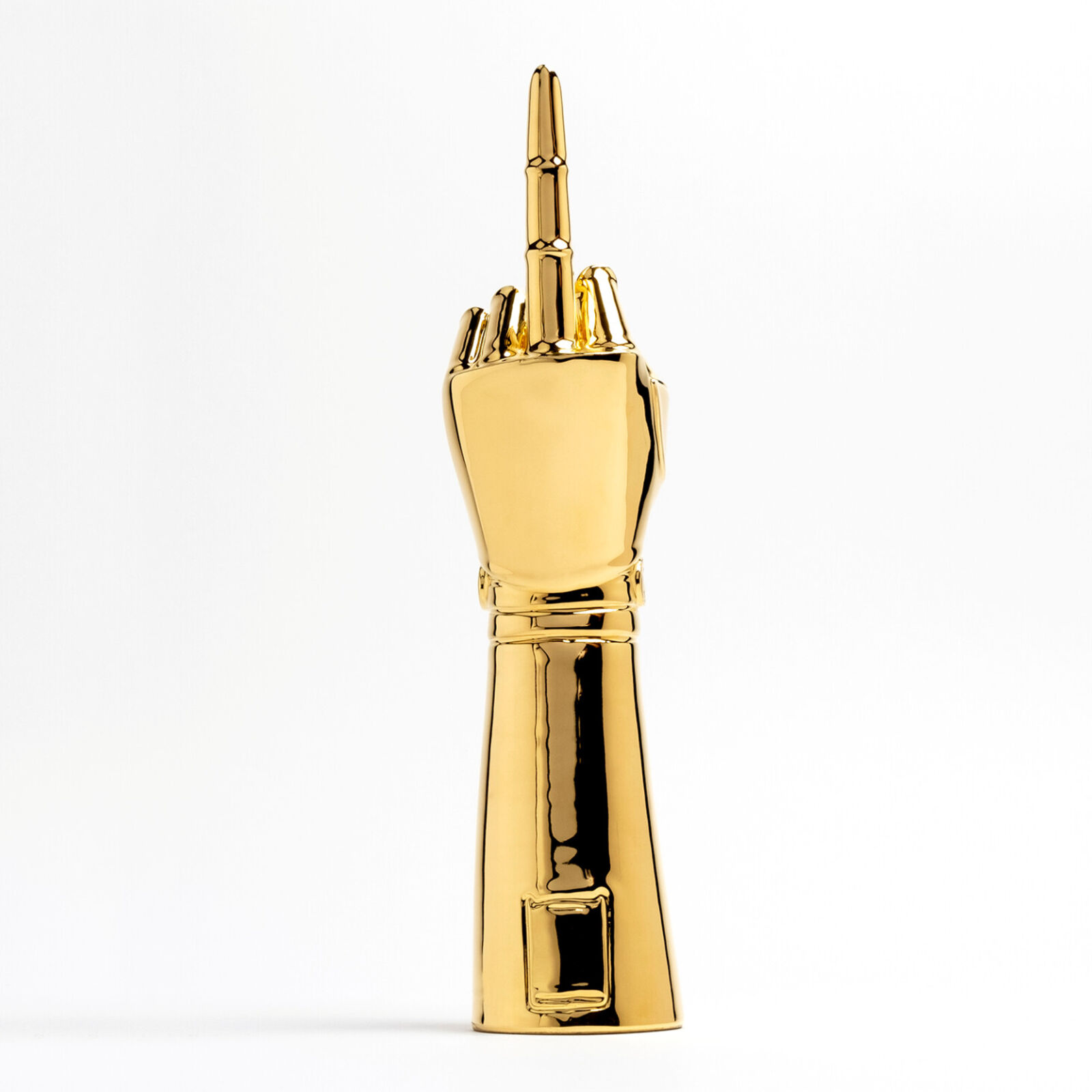 A gold statue of a hand holding a microphone.