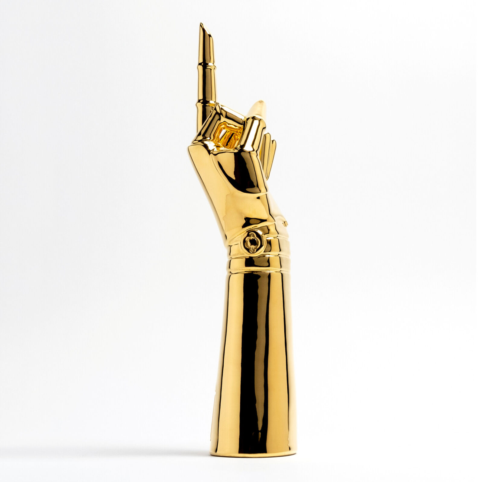 A gold statue of a hand holding a microphone.