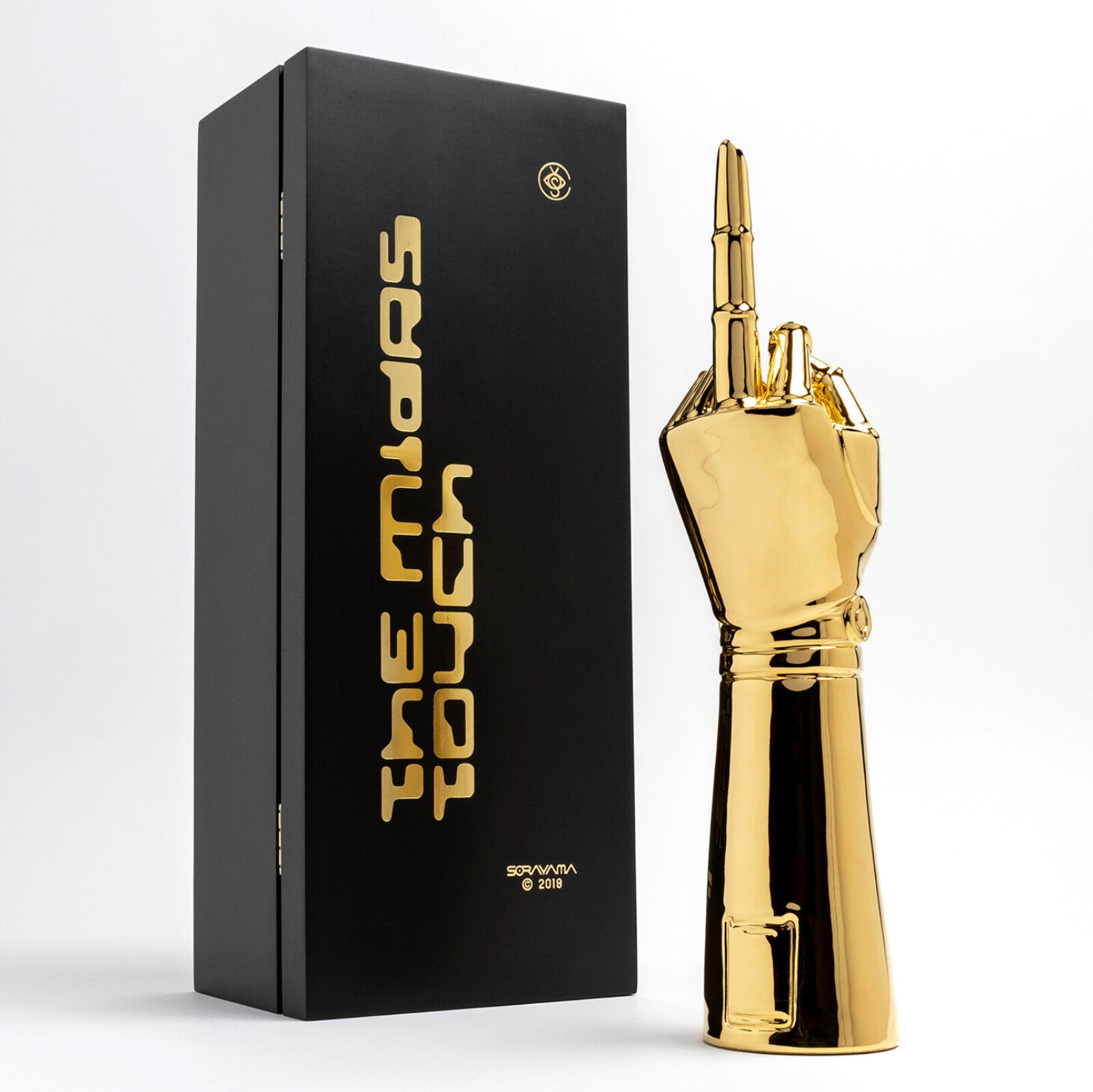 A gold statue of a hand holding a microphone.