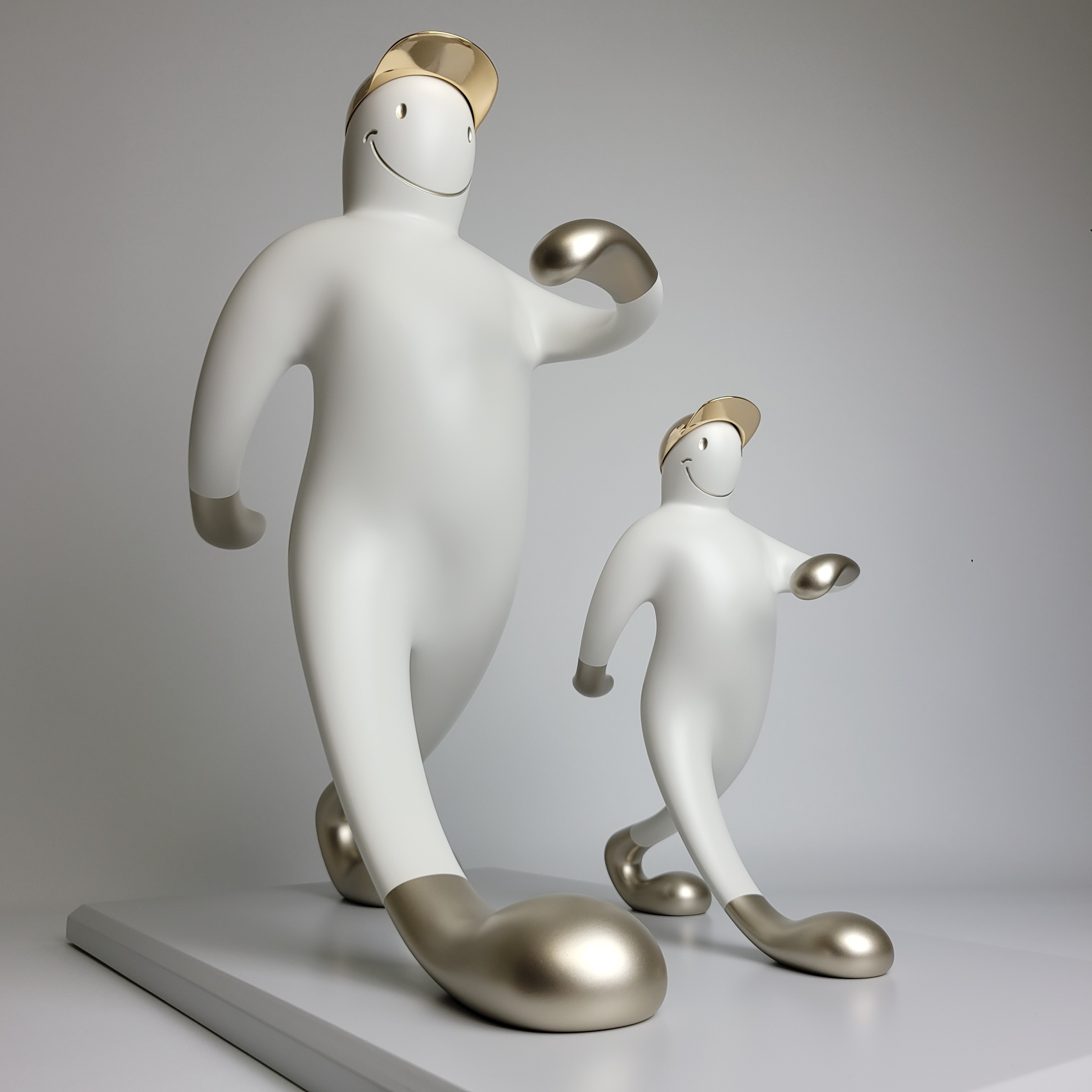 A playful sculpture of two figures in a matching pose, featuring smooth white forms with metallic accents.