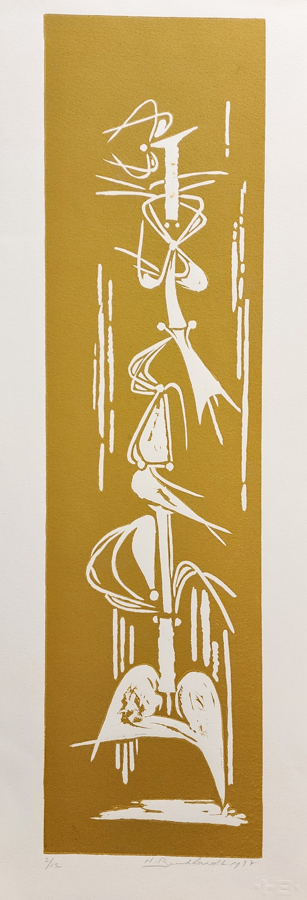 A gold and white print of a woman in a dress.