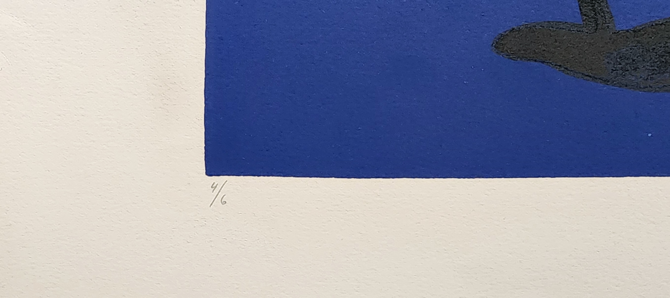 A blue and red painting on a white wall.