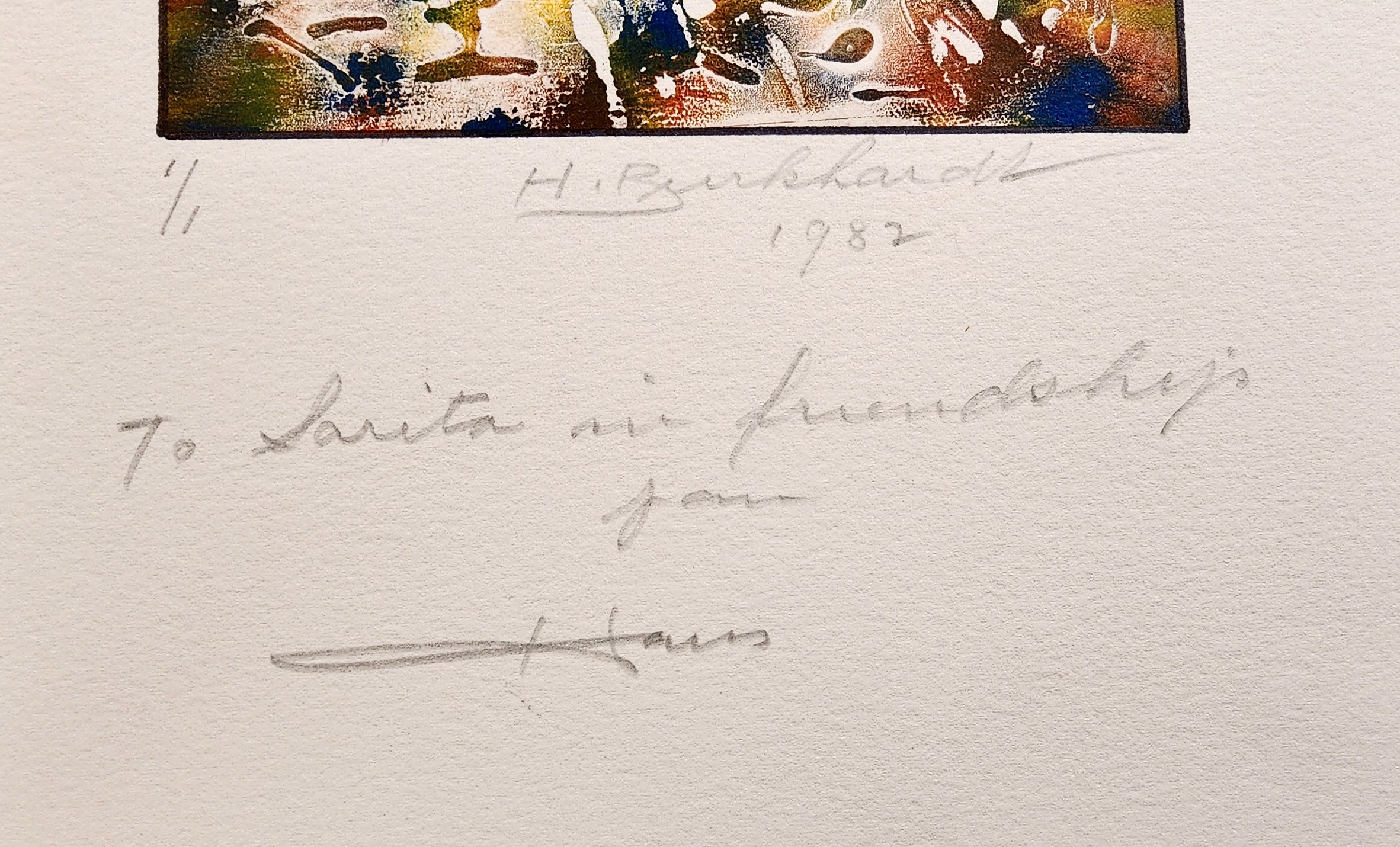 A painting on a piece of paper with a handwritten message.