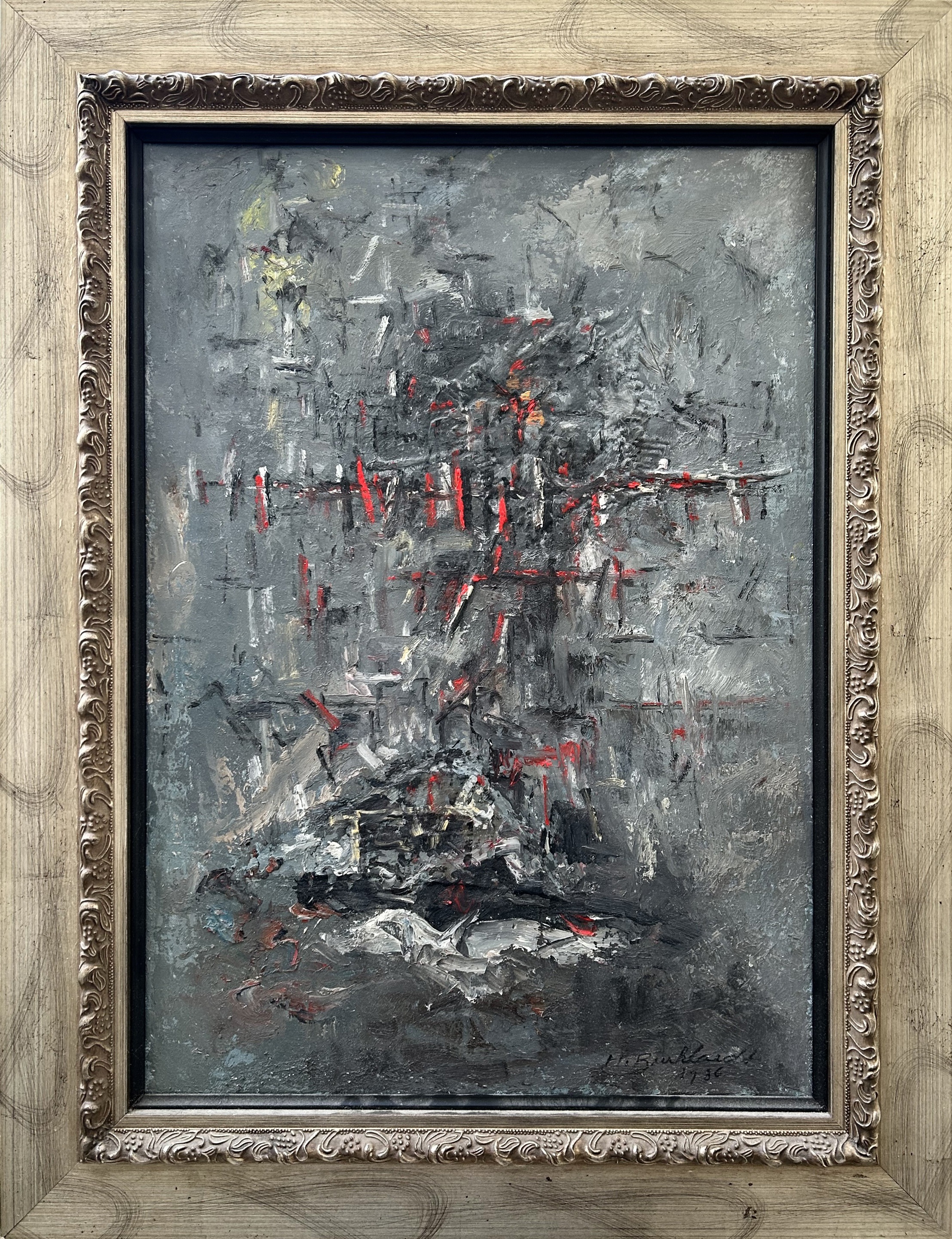 A painting with black and red paint on a gray background.