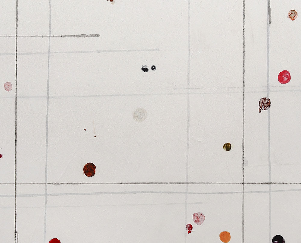 A white circle with a grid of dots on it.