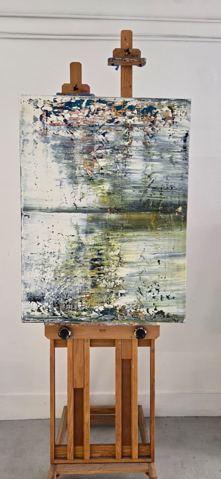 An abstract expressionist painting featuring a textured, layered composition of muted greens, whites, and splashes of vibrant color.