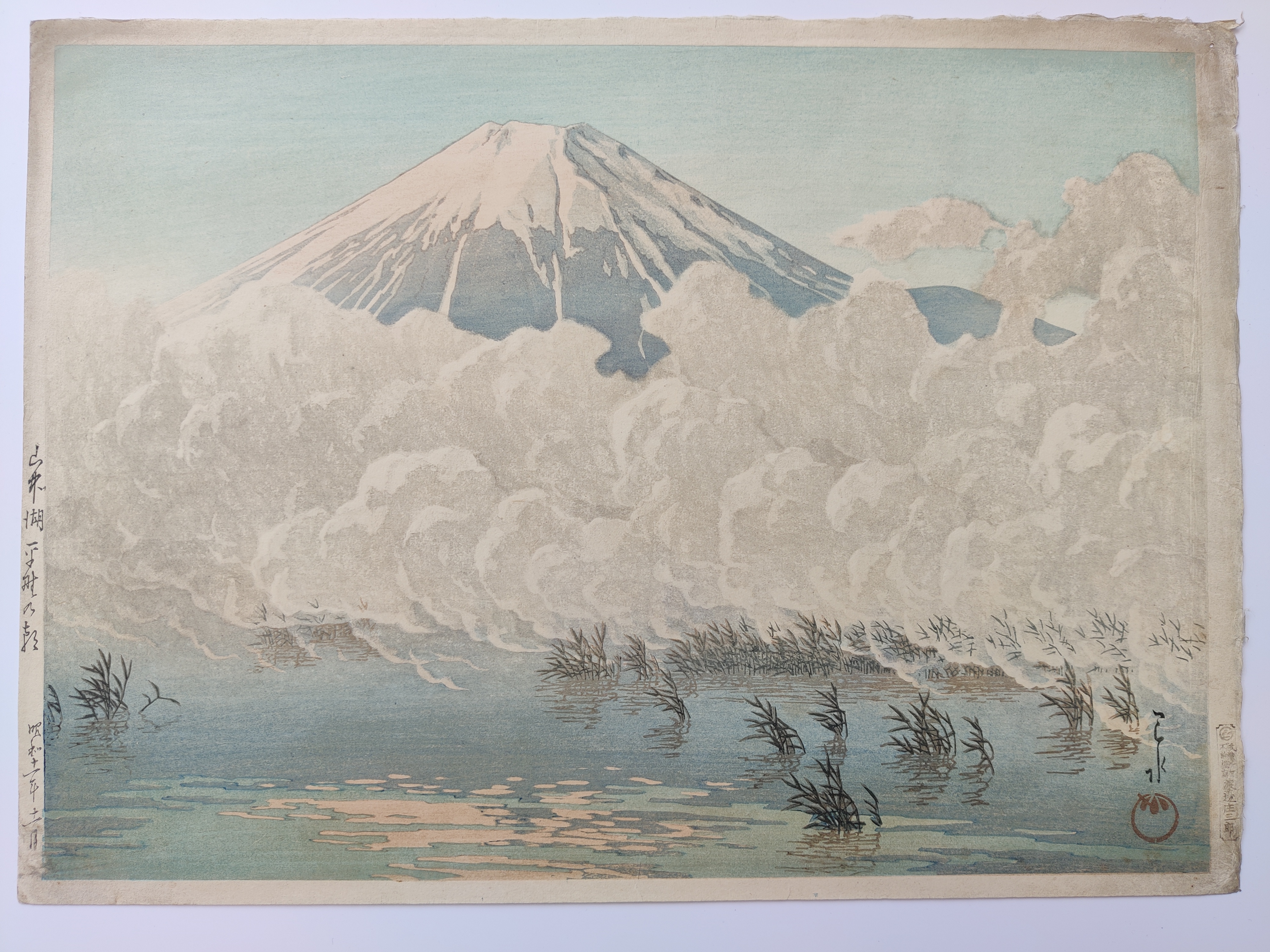 A painting of a mountain with clouds in the sky.
