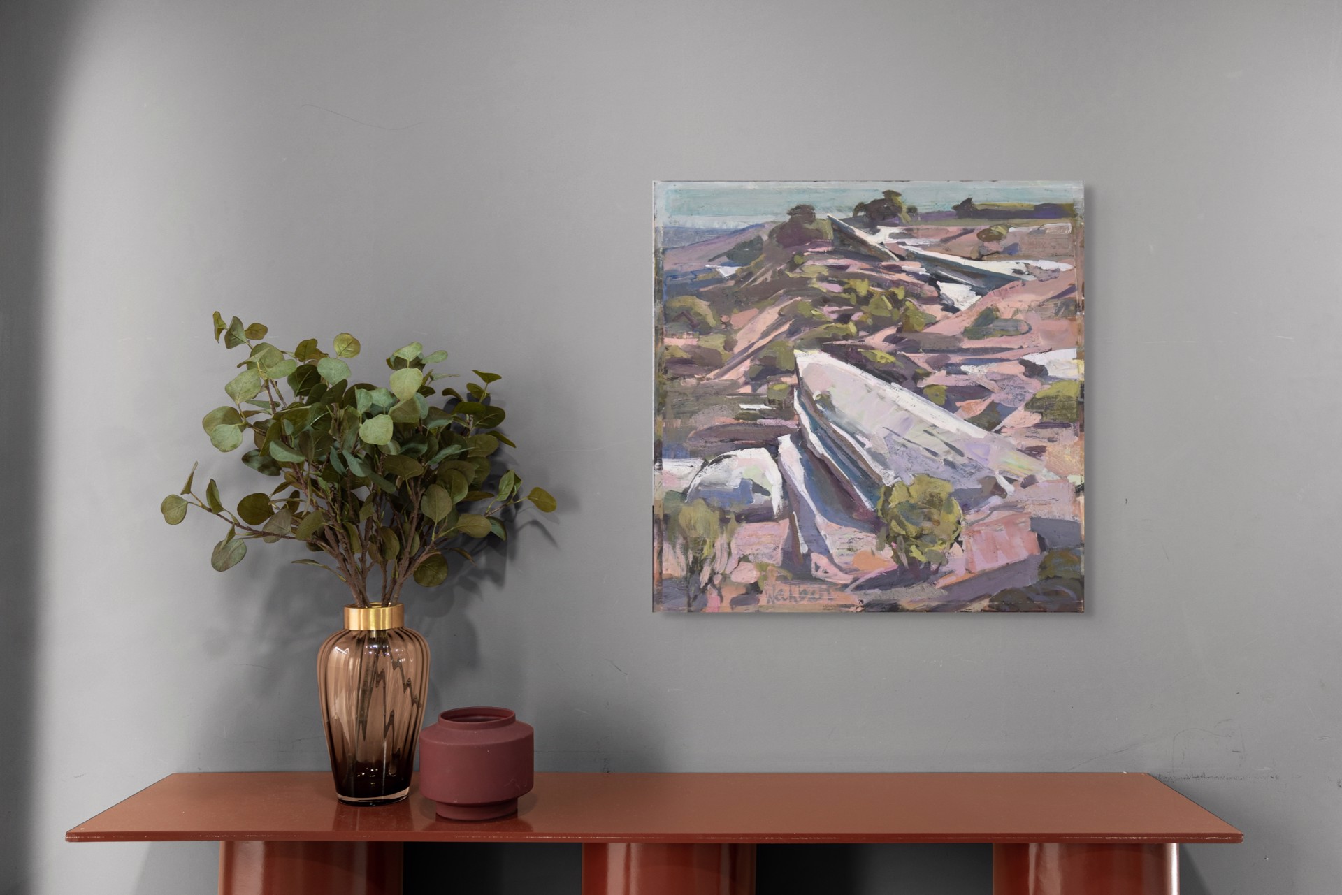 A painting of a boat sitting on top of a rocky hillside.