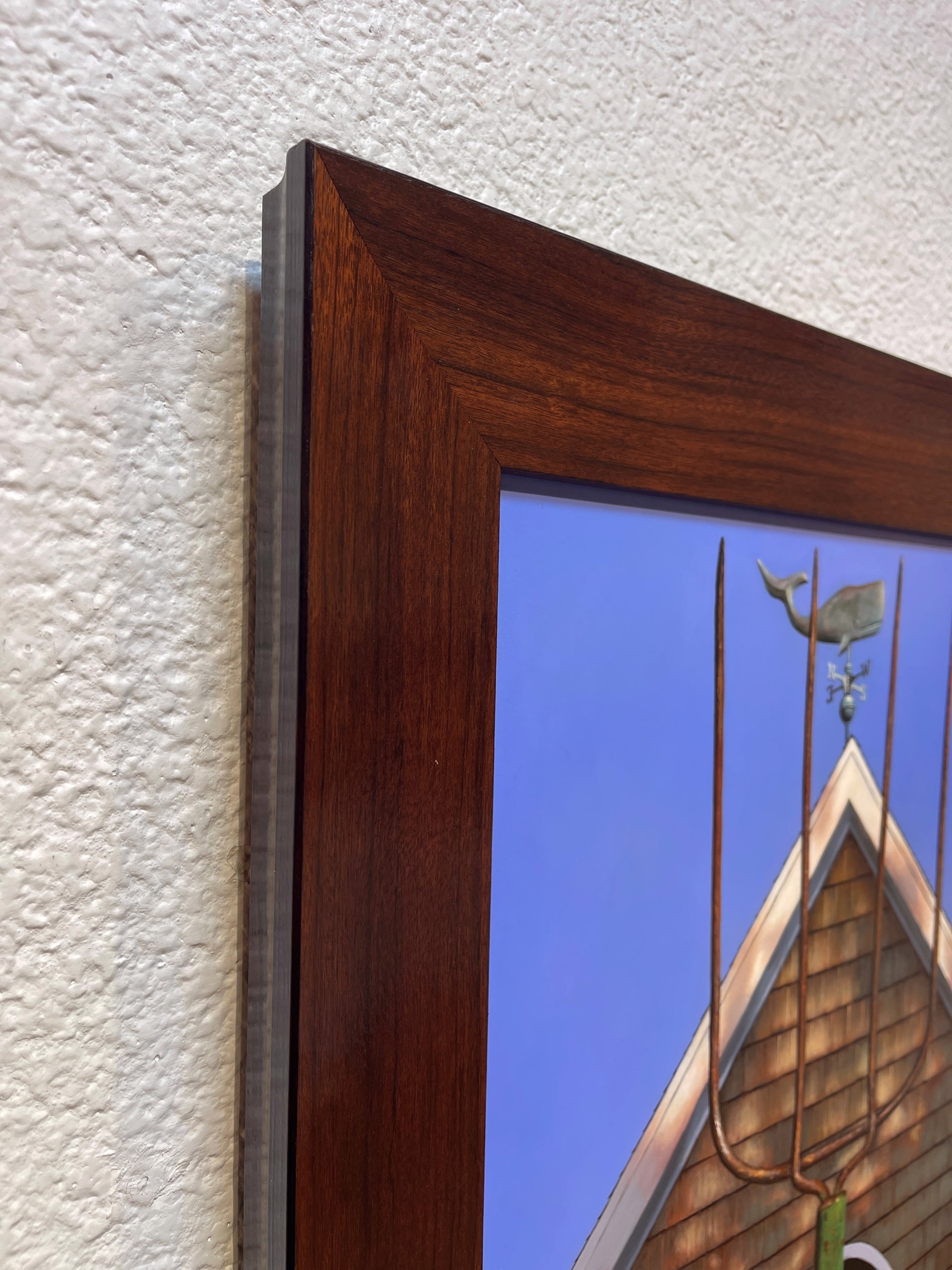 A painting of two hands holding a pitchfork in front of a house.