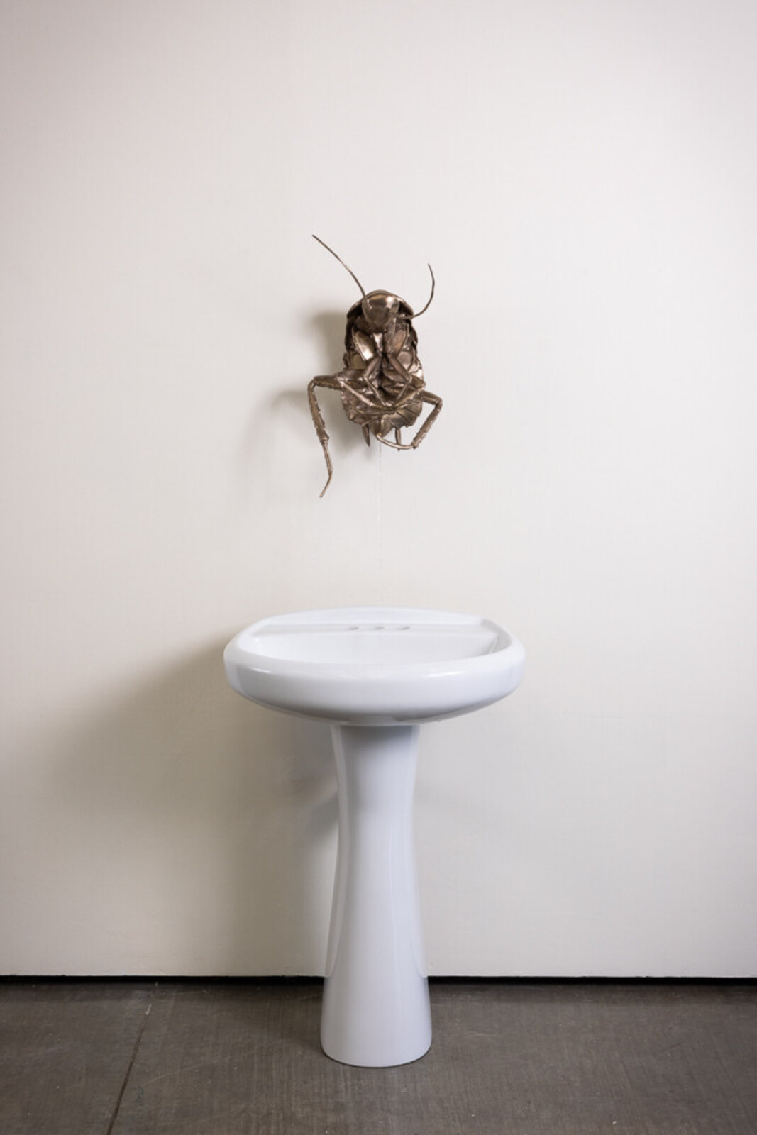 Artwork by Heidi Schwegler, A Ladies Man, Made of Bronze, fountain motor, bucket, plumbing 